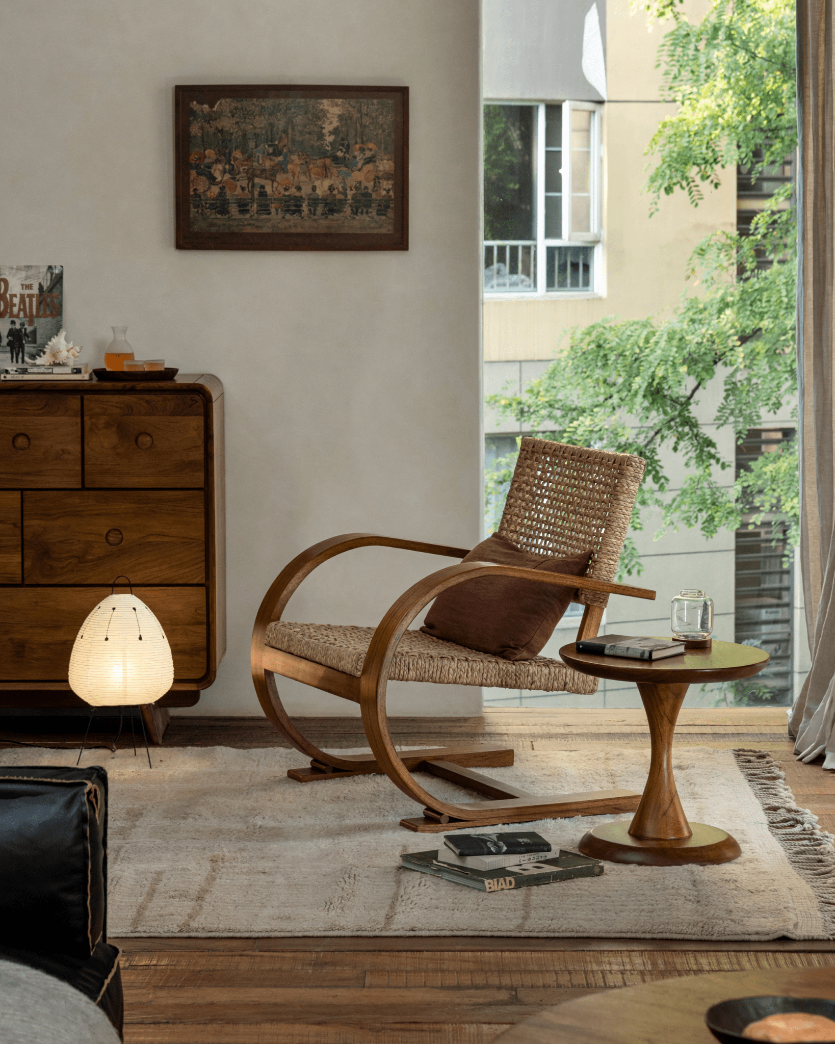 C Curve Lounge Chair in a mid-century modern living room setting, featuring bentwood frame, woven seat, cozy interior.