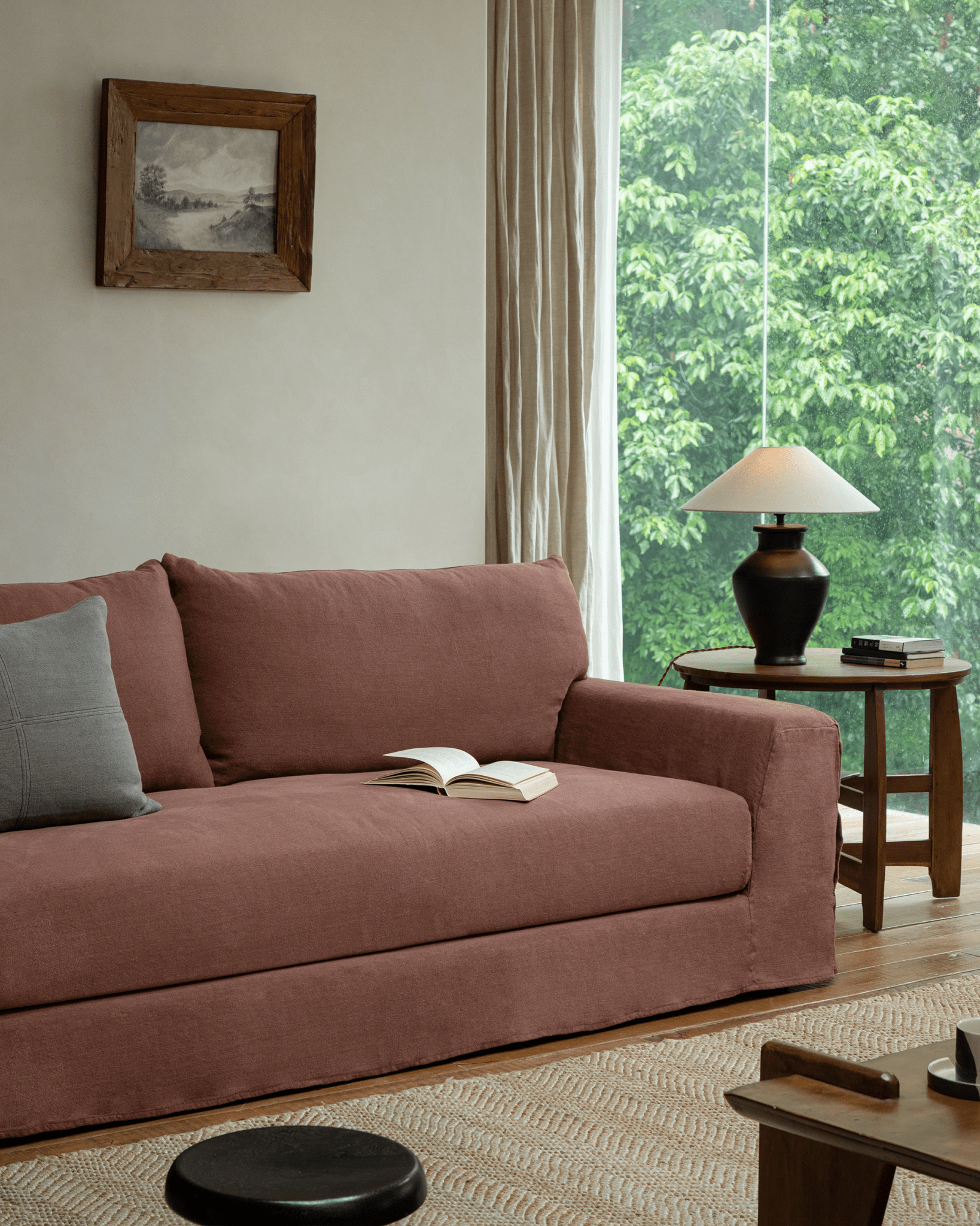 Terracotta Guni Linen Sofa in a cozy living room, linen fabric, and natural textures.