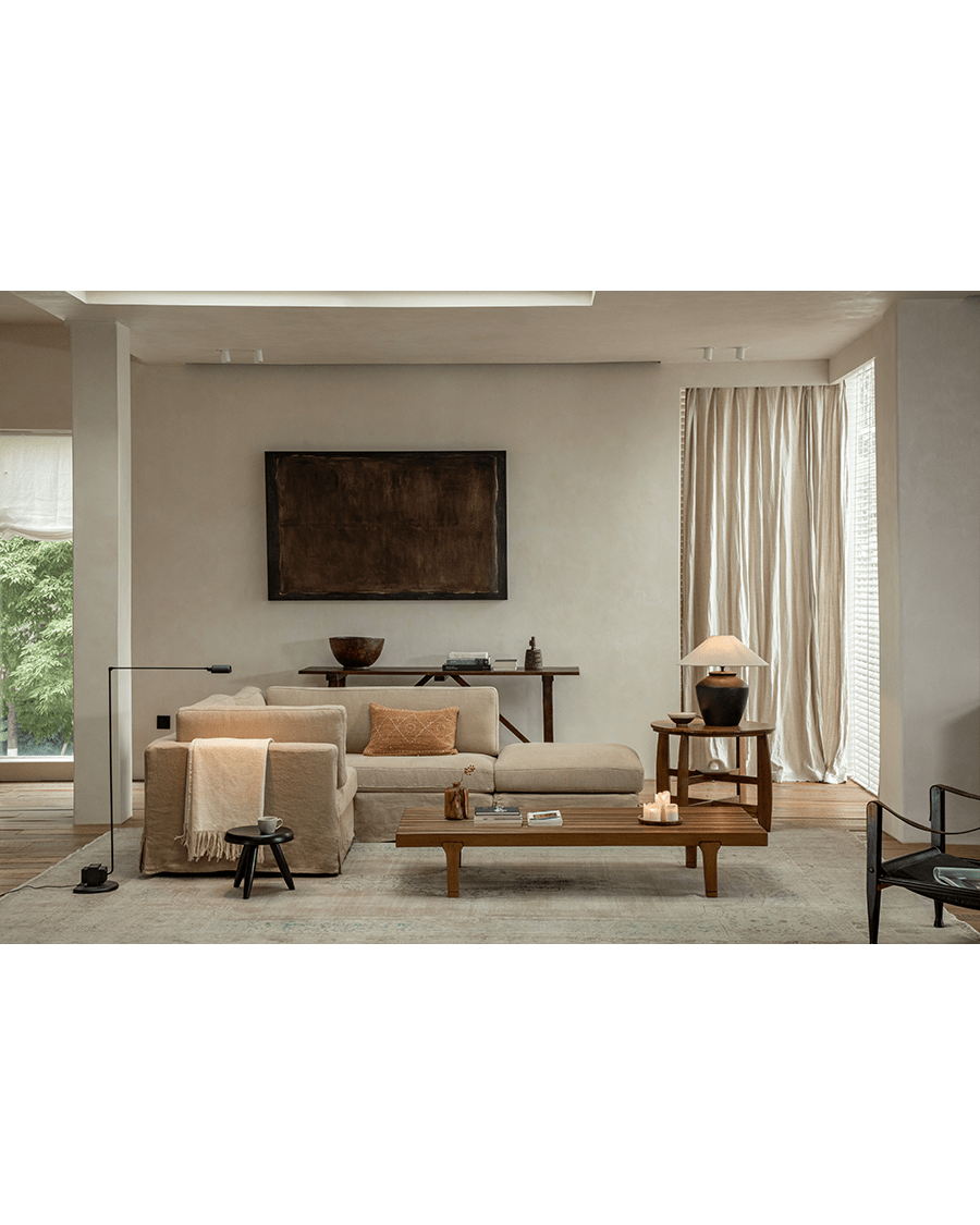 Skirt Sectional Sofa: modular light beige linen sofa in a modern living room.