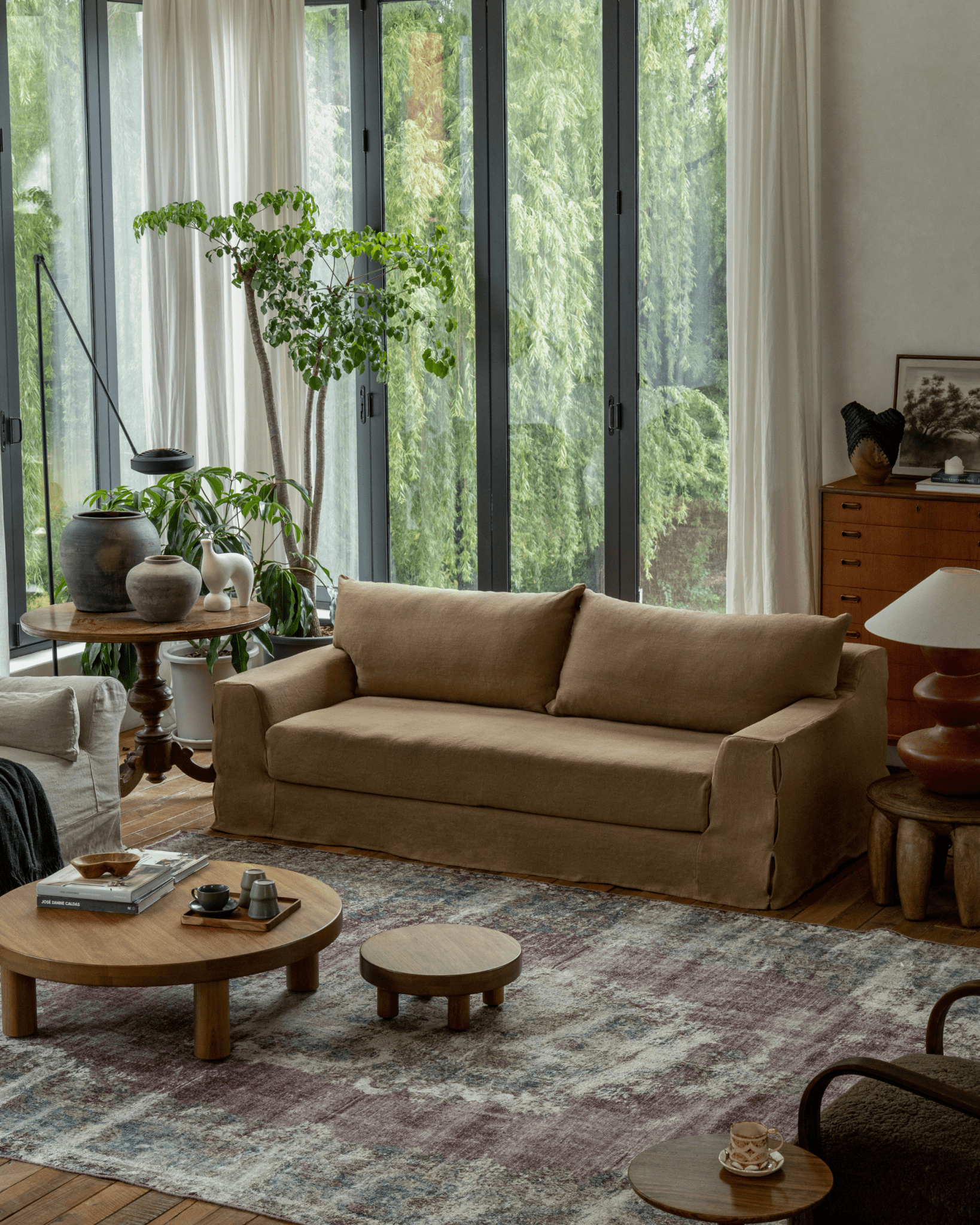 Guni terracotta linen sofa in a cozy living room setting with natural light, showing triple filling and linen fabric