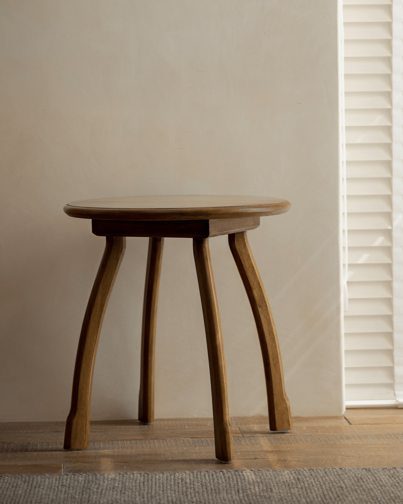 Ele Round Side Table in Phoebe wood, vintage finish with octopus legs