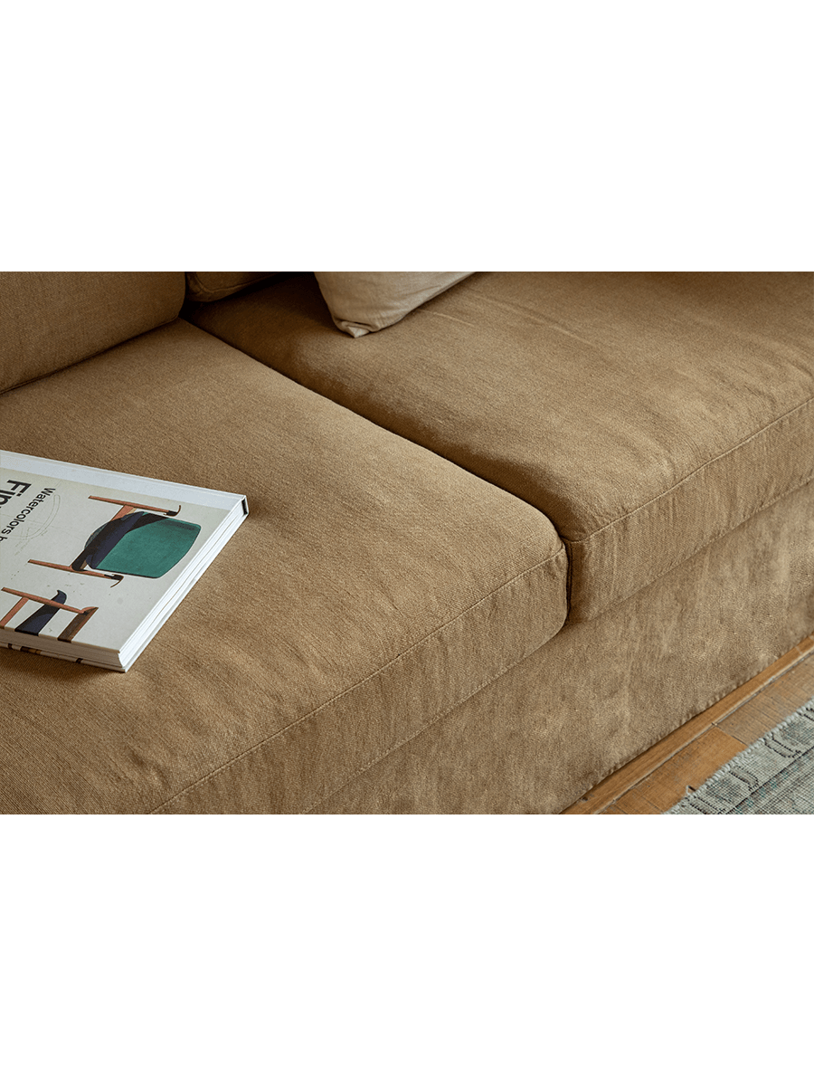 Skirt Linen Sofa in tan linen. Modern design, breathable fabric. Ideal for a comfortable and peaceful living space.
