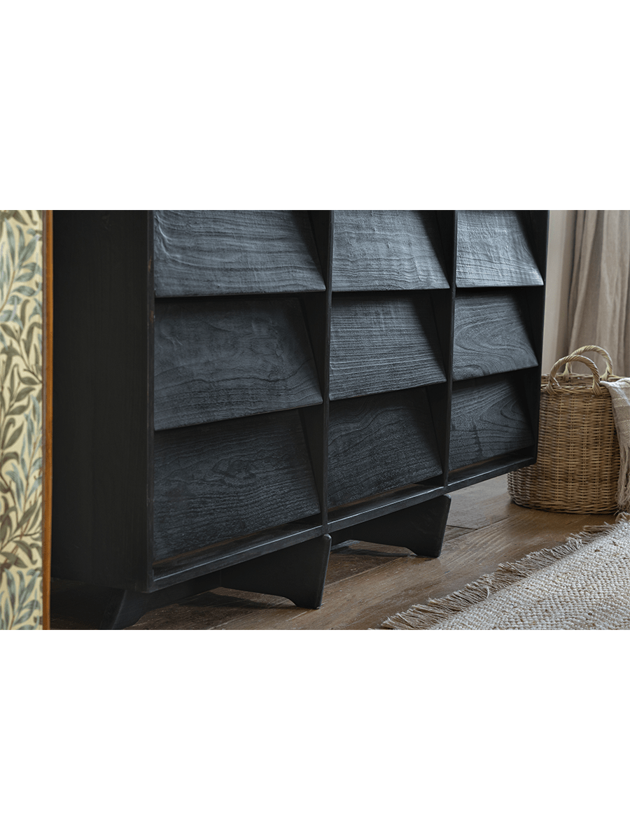 NO.9 Sideboard in minimalist living room, featuring dark reclaimed wood, angled drawer design, and a floating base.