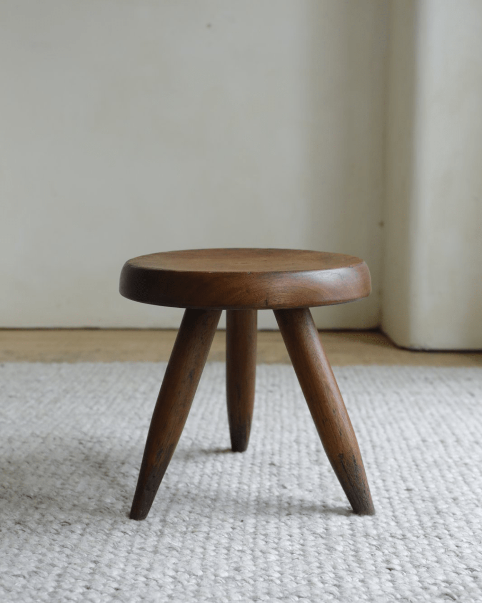 French stool, solid wood construction with three legs and round seat, natural wood finish, modern home decor