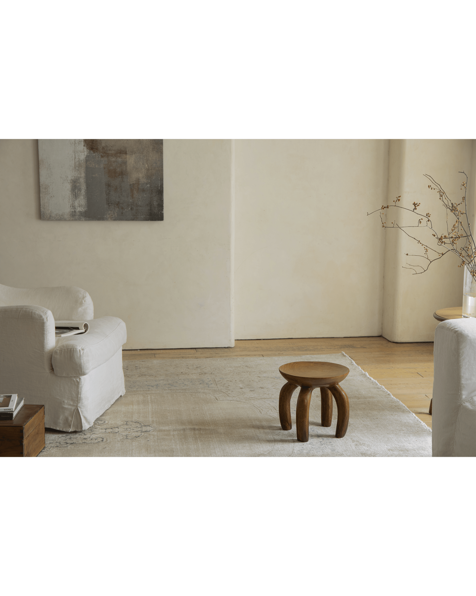 Jelly Stool in living room setting. Handcrafted solid wood, unique design, sustainable furniture.