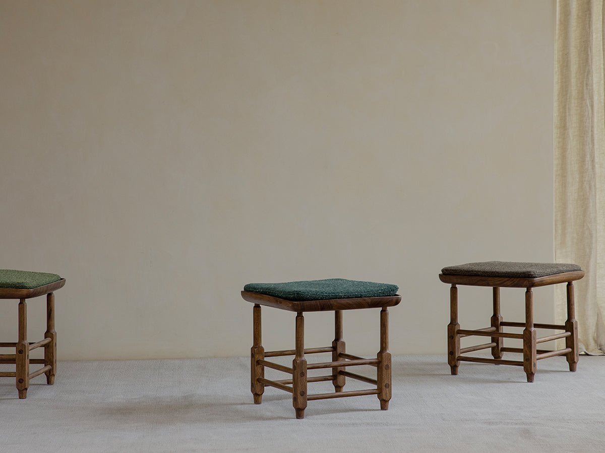 Magrini Stool in zebrawood with green and brown cushions. Modern interior design.