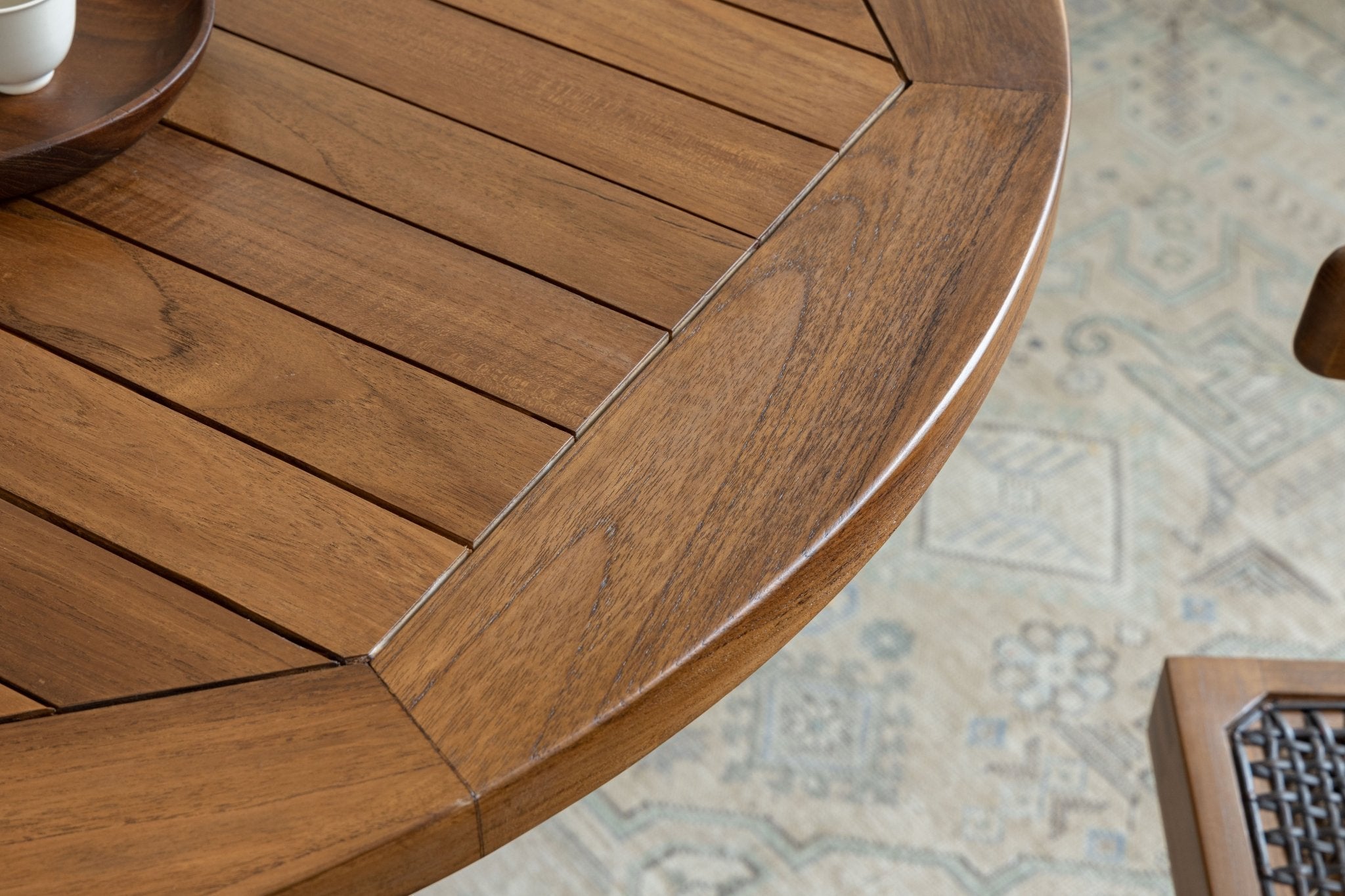 Ruby Teak Round Table detail: solid wood tabletop with slatted design, perfect as dining or leisure table