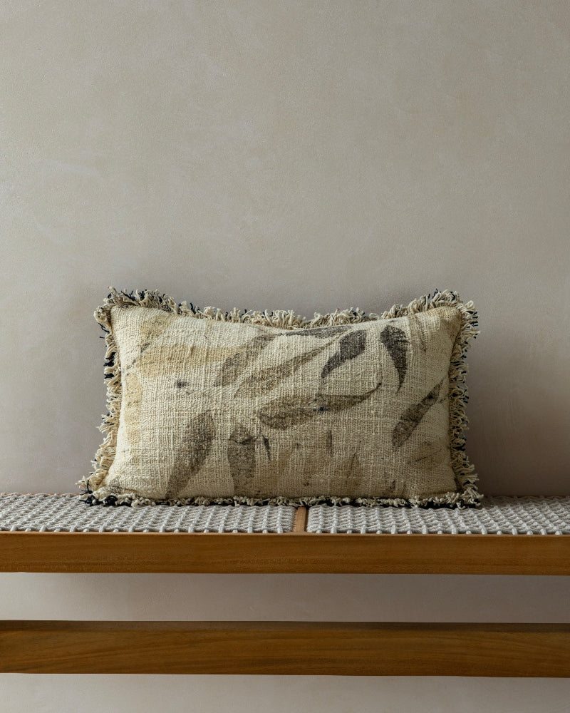 Verda Pillow: Soft hand-crocheted cotton with unique plant motifs and frayed edges.