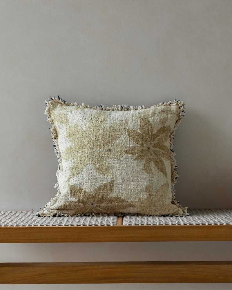 Verda Pillow: Hand-crocheted cotton with beige botanical print, textured weave, and fringed edges.