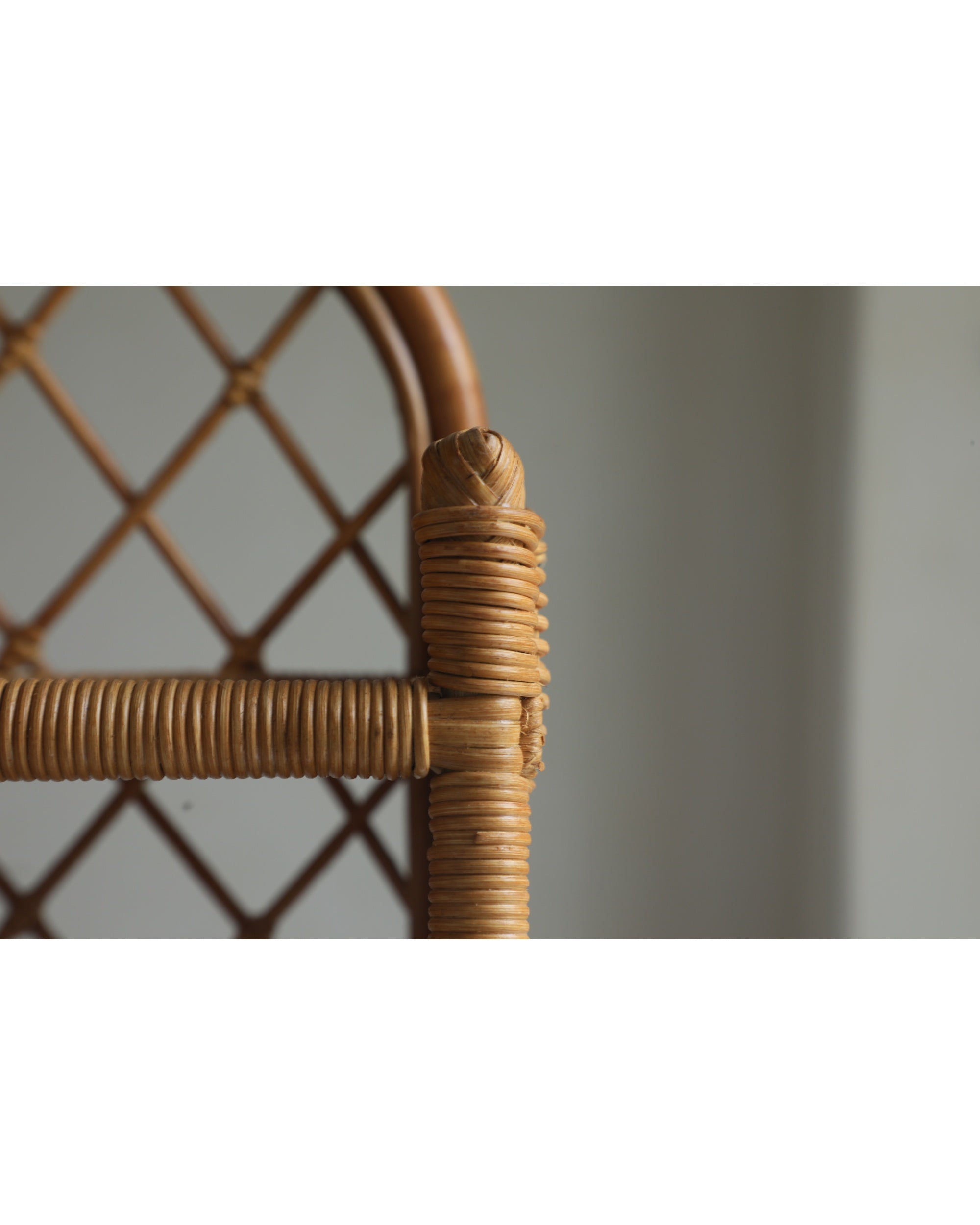 Solana Stand: natural woven rattan detail with diamond pattern.