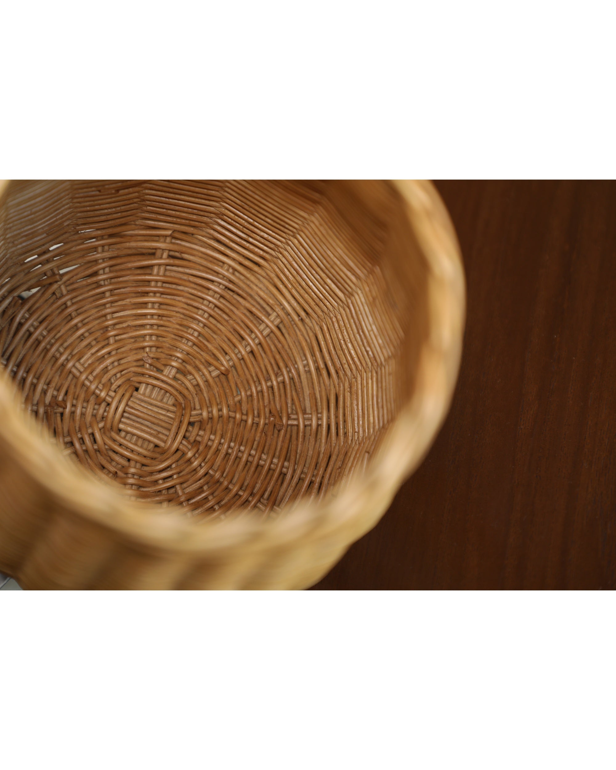 Elodie round storage basket interior: natural woven rattan weave detail.