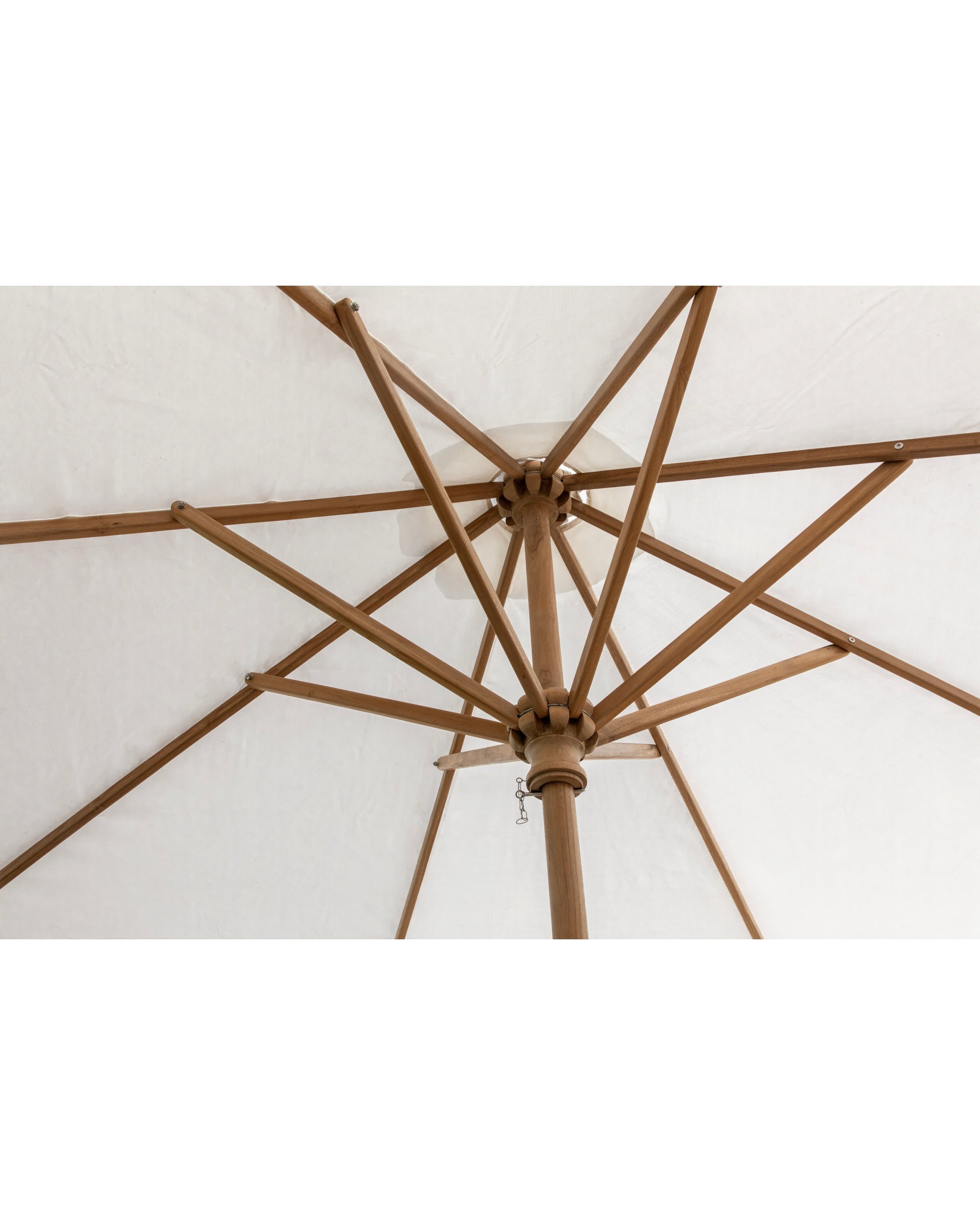 Teak wood frame and white fabric underside of outdoor patio umbrella