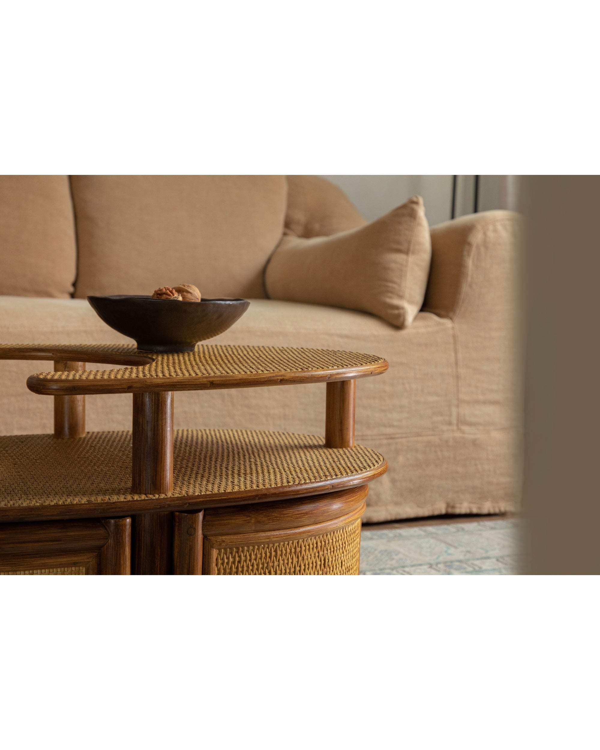 Noa Rattan Wheeled Table: natural woven cane, double-layer, mobile side table.