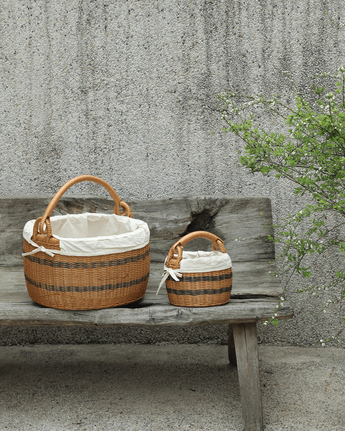 Sunday Picnic handwoven rattan bucket baskets, two sizes, with cotton lining.