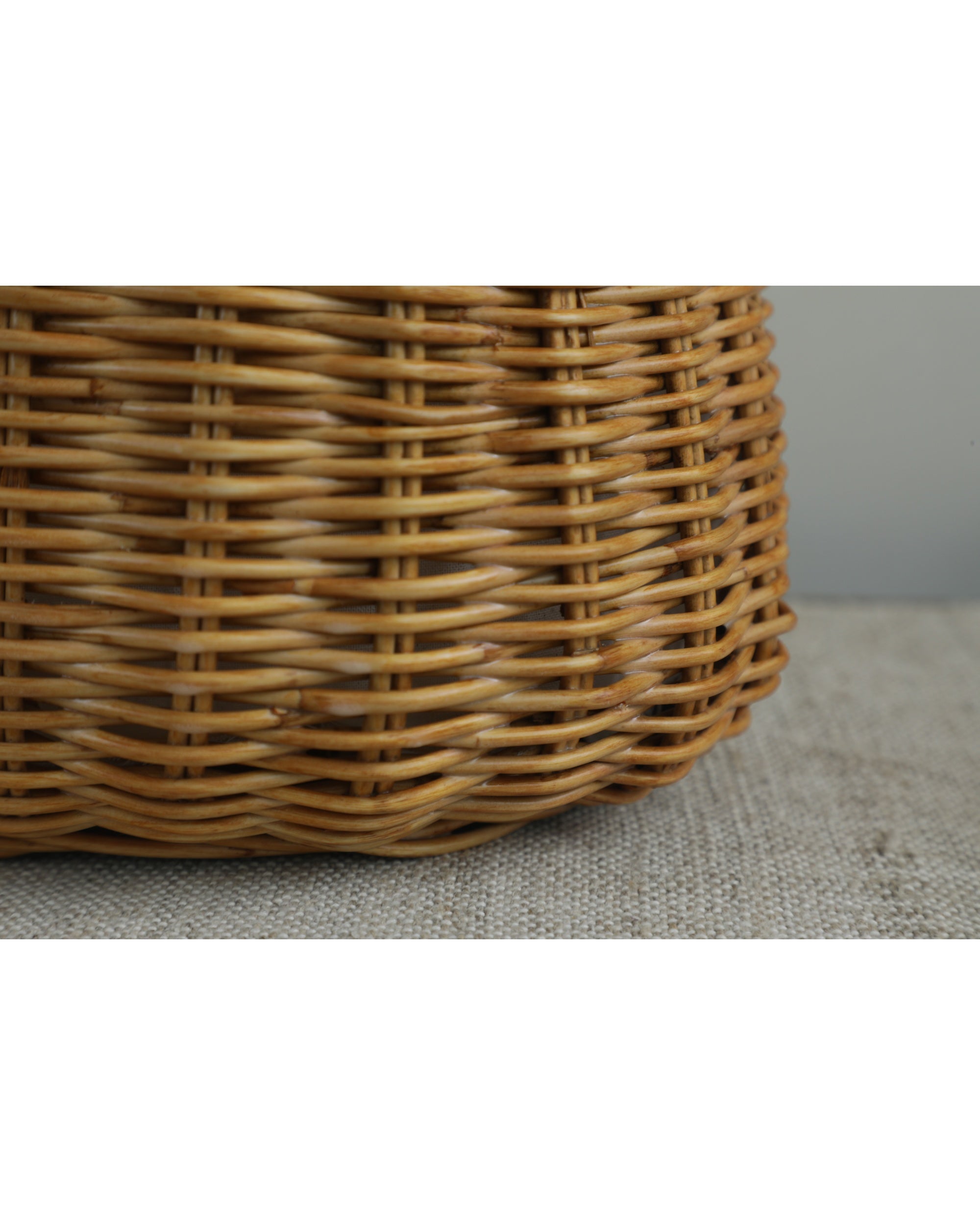 Close-up of the intricate woven rattan texture of the Ivy Hand Bag