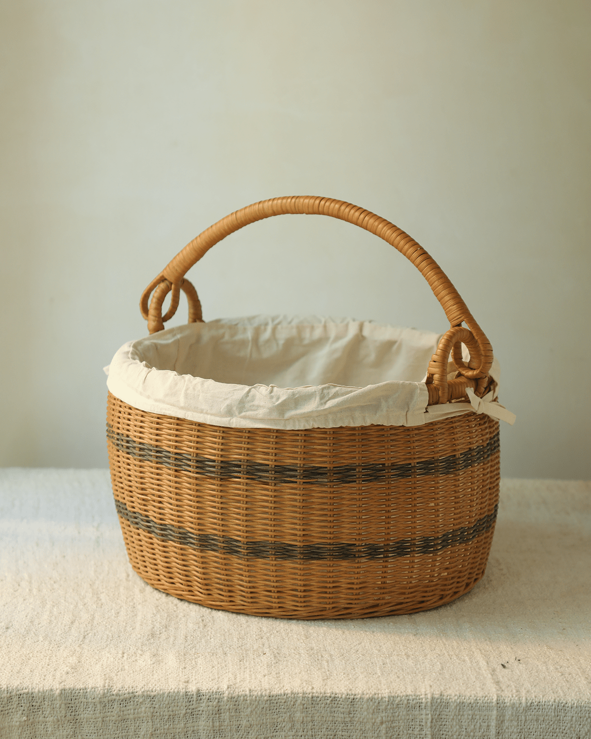 Sunday Picnic Bucket: Handwoven striped rattan basket with lining and handle.