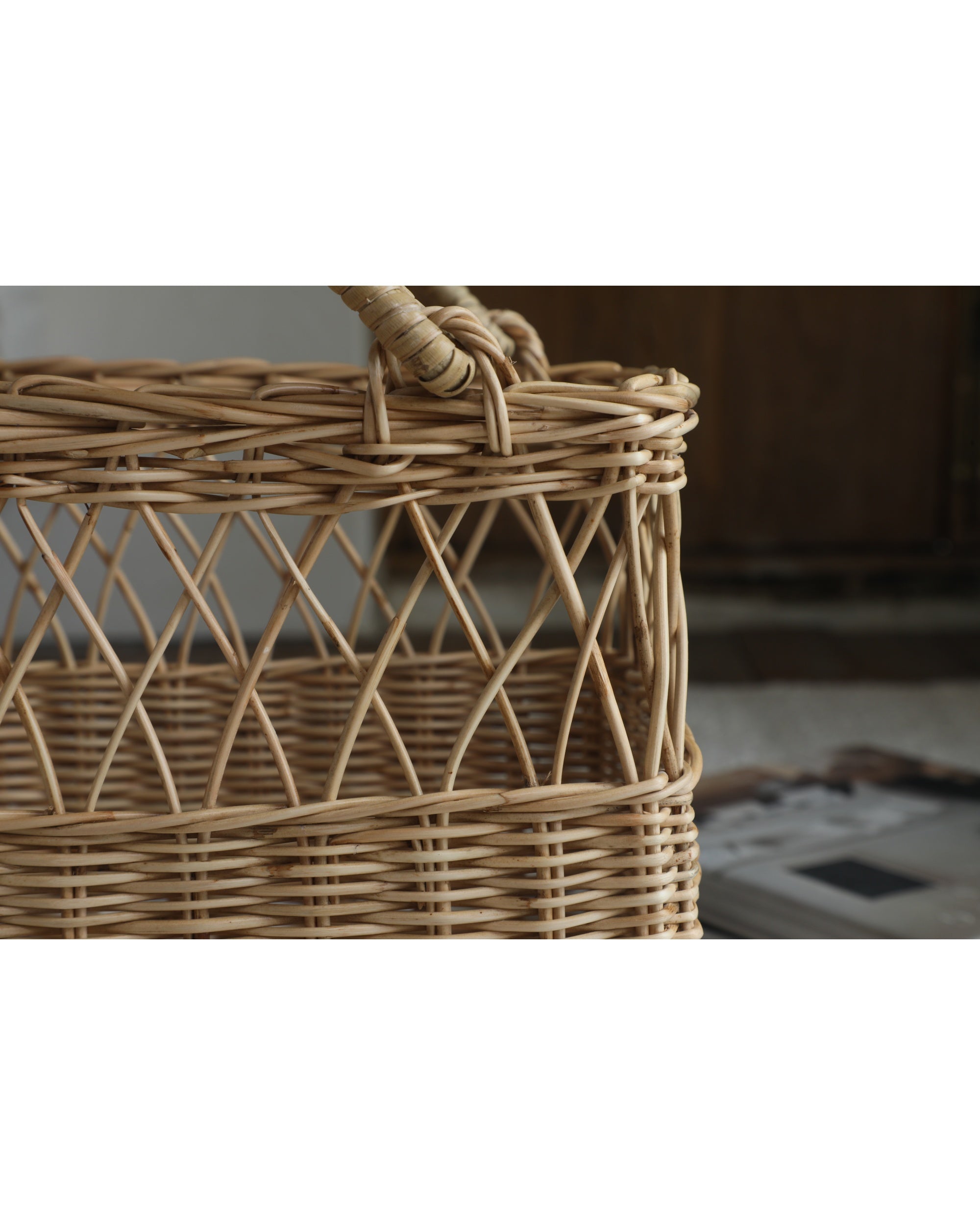Lina Basket: dual-texture woven rattan basket with openwork pattern and handles.