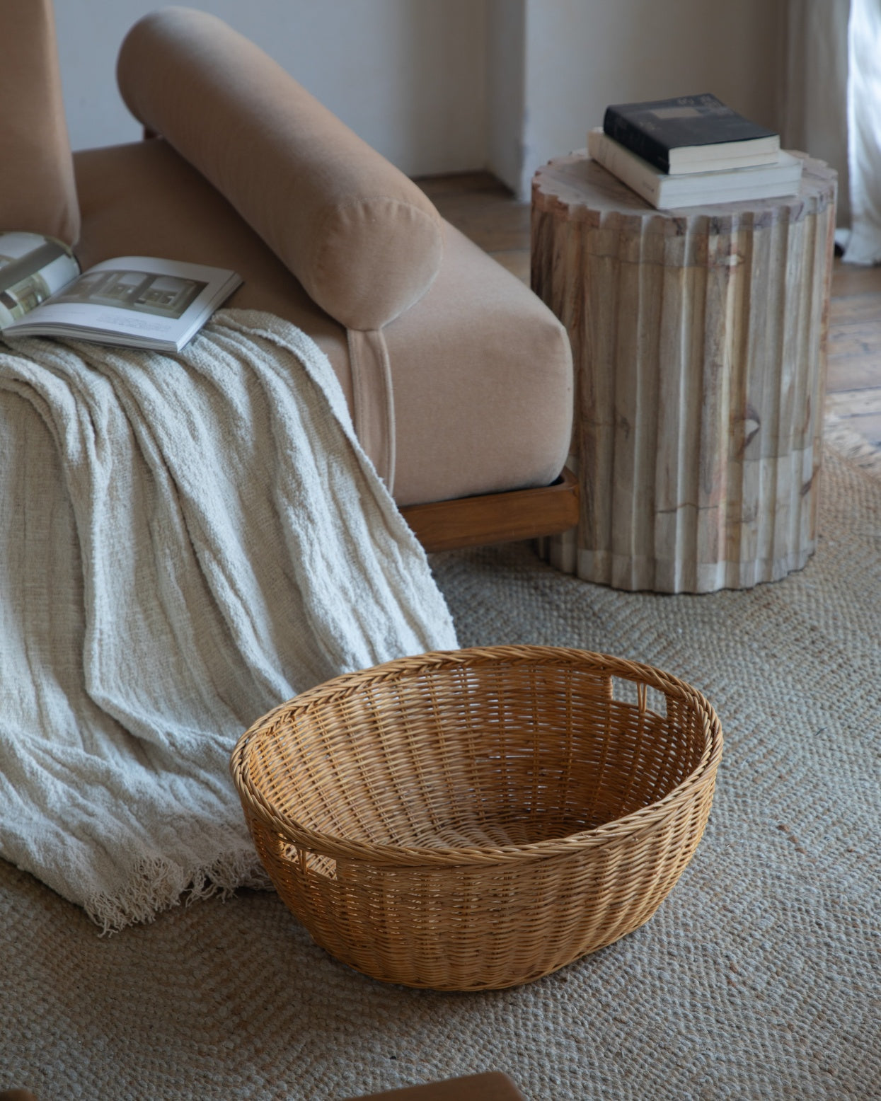 Dottie Basket: Hand-crafted natural rattan woven storage basket with handles.