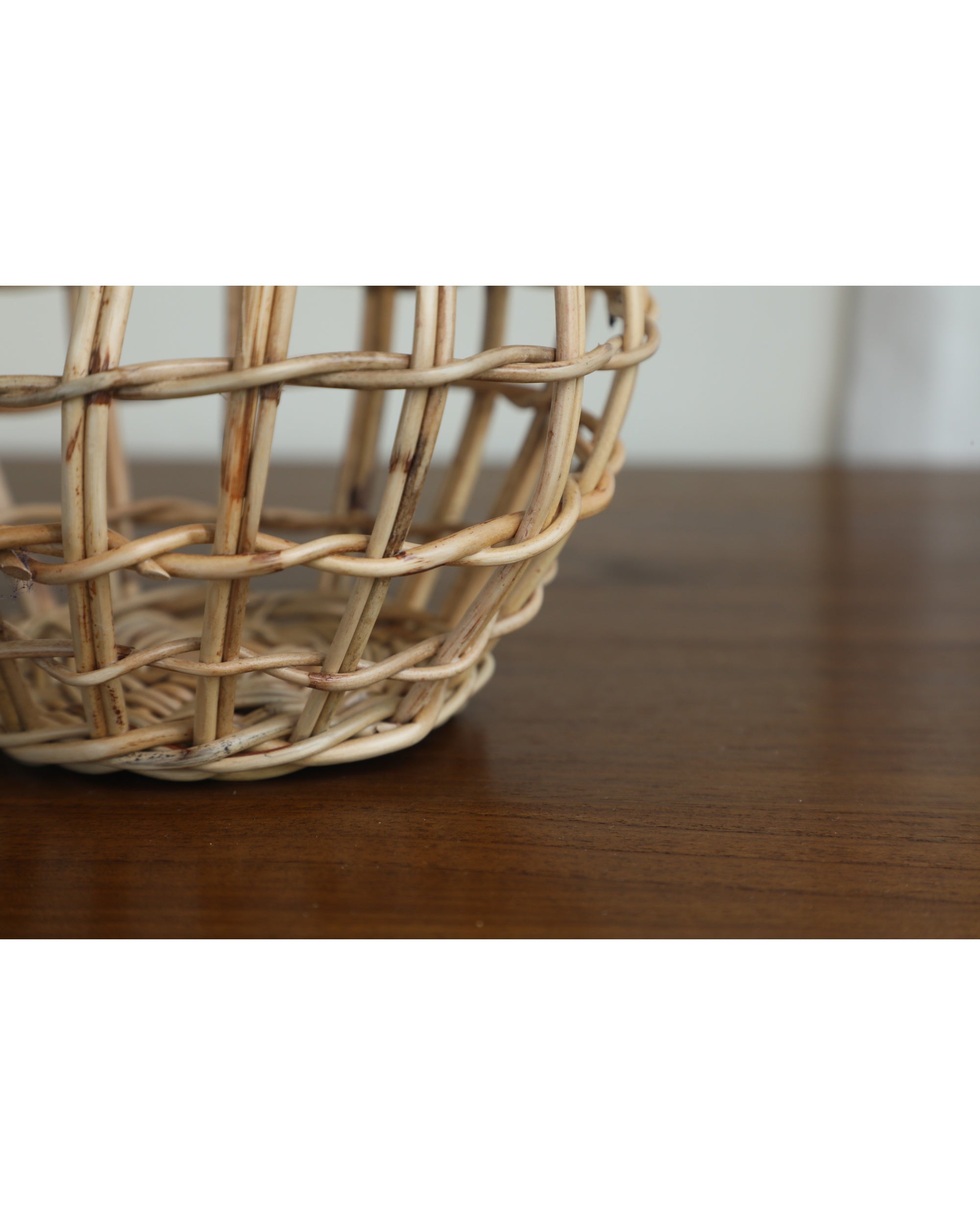 Natural rattan Cove hanging basket, hand-woven with a distinctive open-weave pattern.