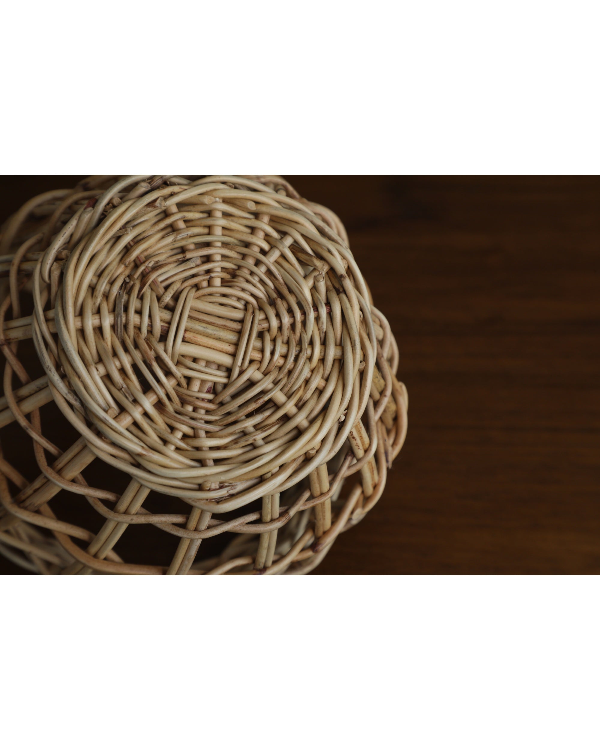 Close-up of natural rattan Cove hanging basket showing intricate hand-woven texture.