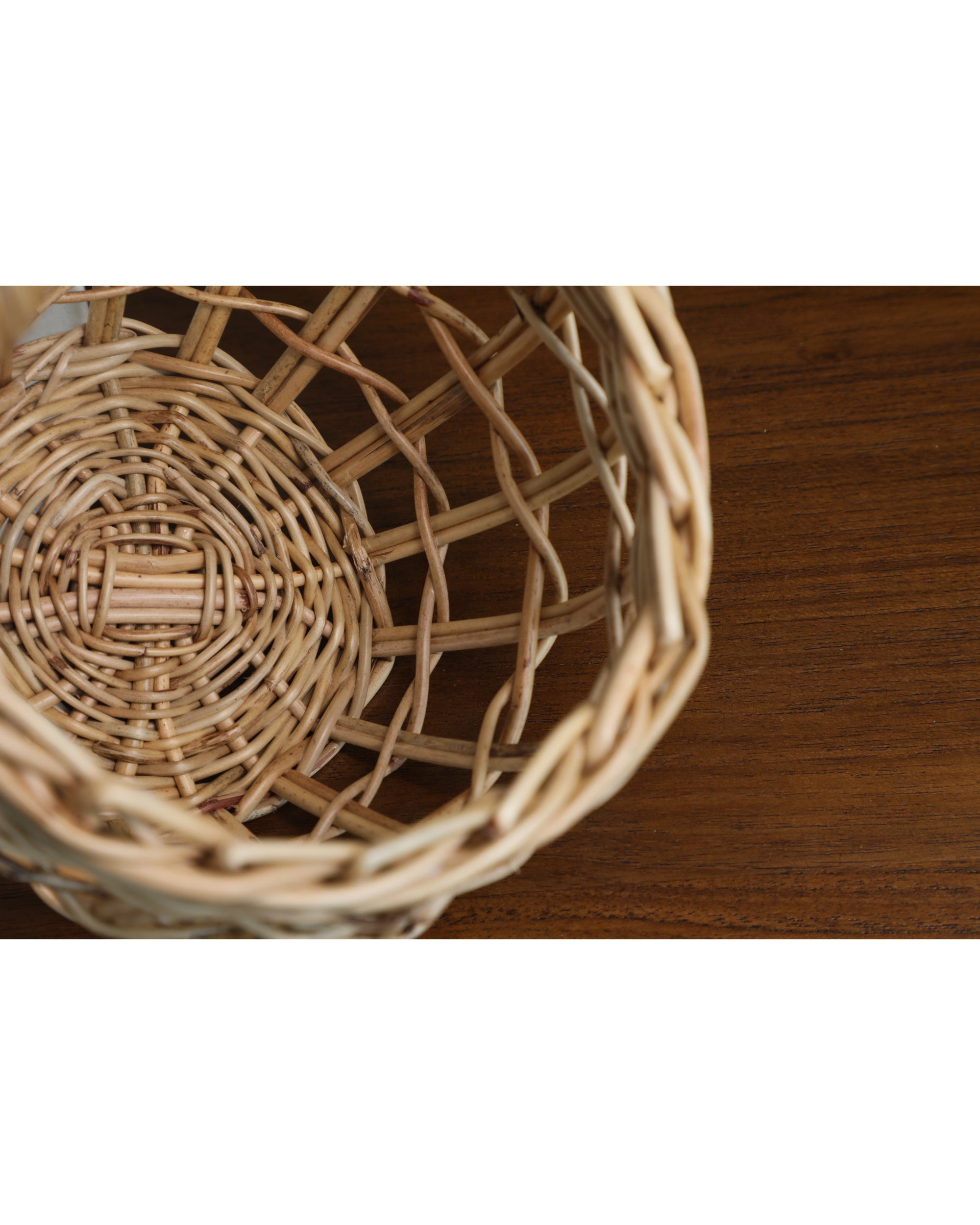 Close-up of Cove basket's hand-woven rattan core and artisanal weave pattern.