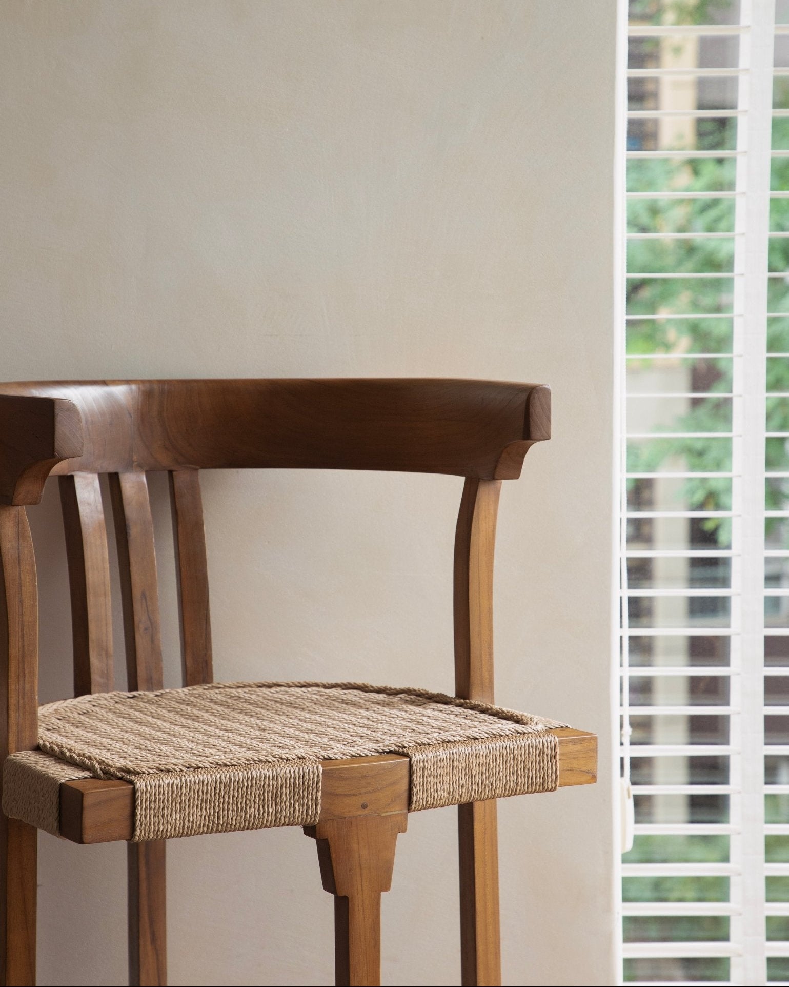Teak Cord Dining Chair with woven seat, perfect for indoor or outdoor use.