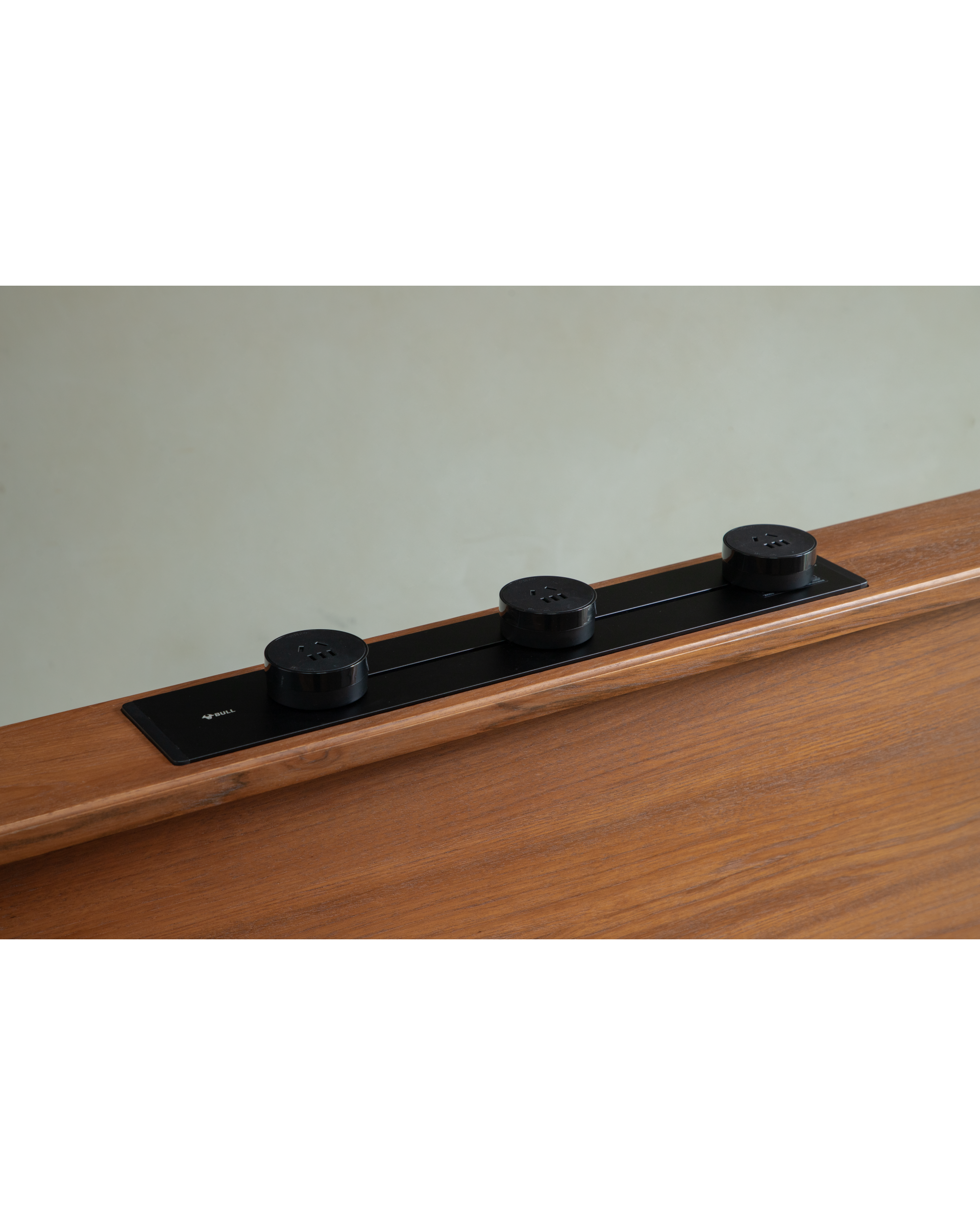 Evan Office Desk with integrated BULL power outlet strip featuring three sockets, teak wood finish.