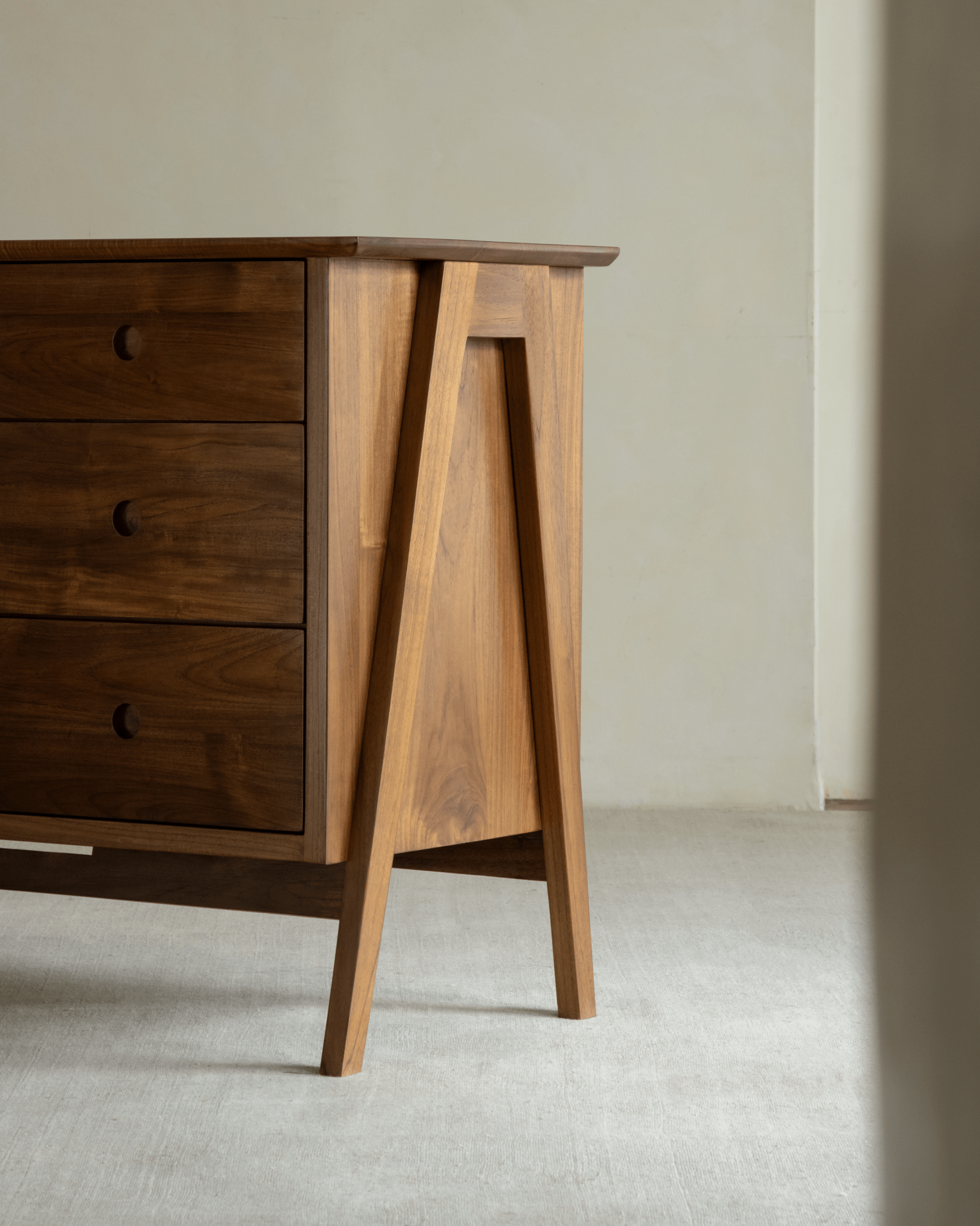 No.23 Teak Sideboard: Minimalist design, vintage charm, and unique triangular legs.