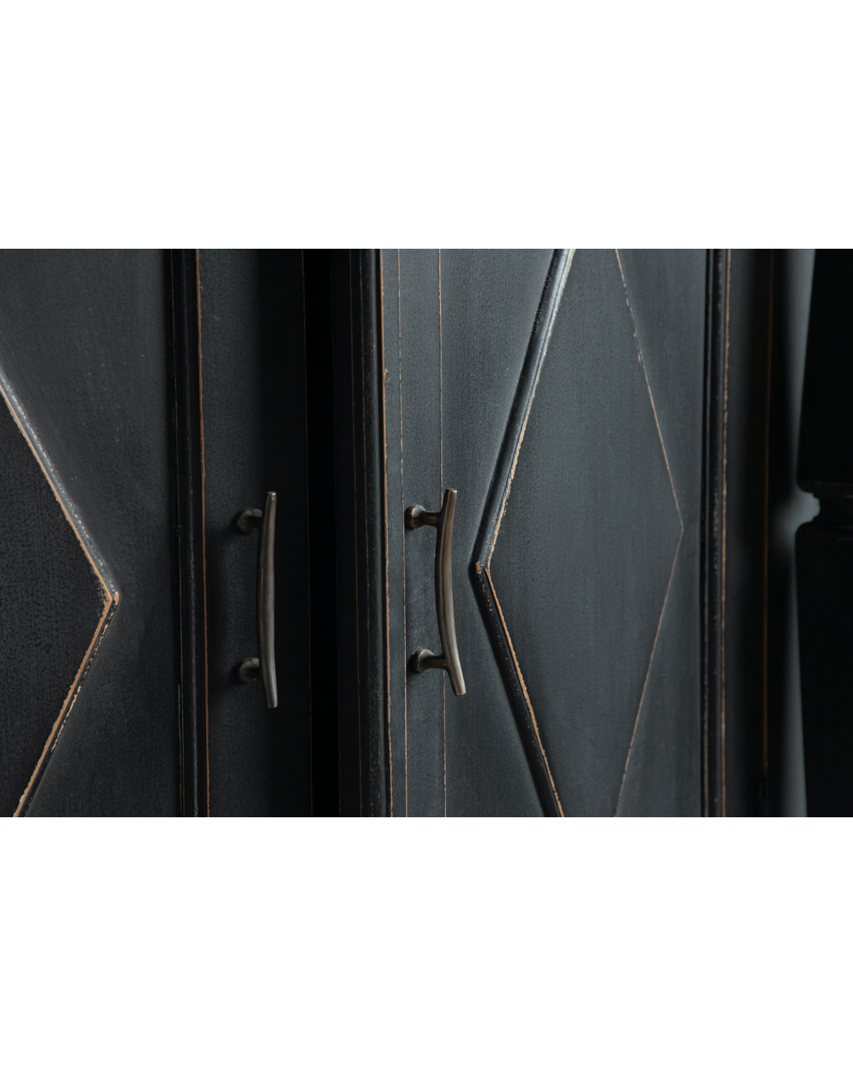 Victoria Teak Cabinet close-up with black antique finish, carved panels, and brass handles