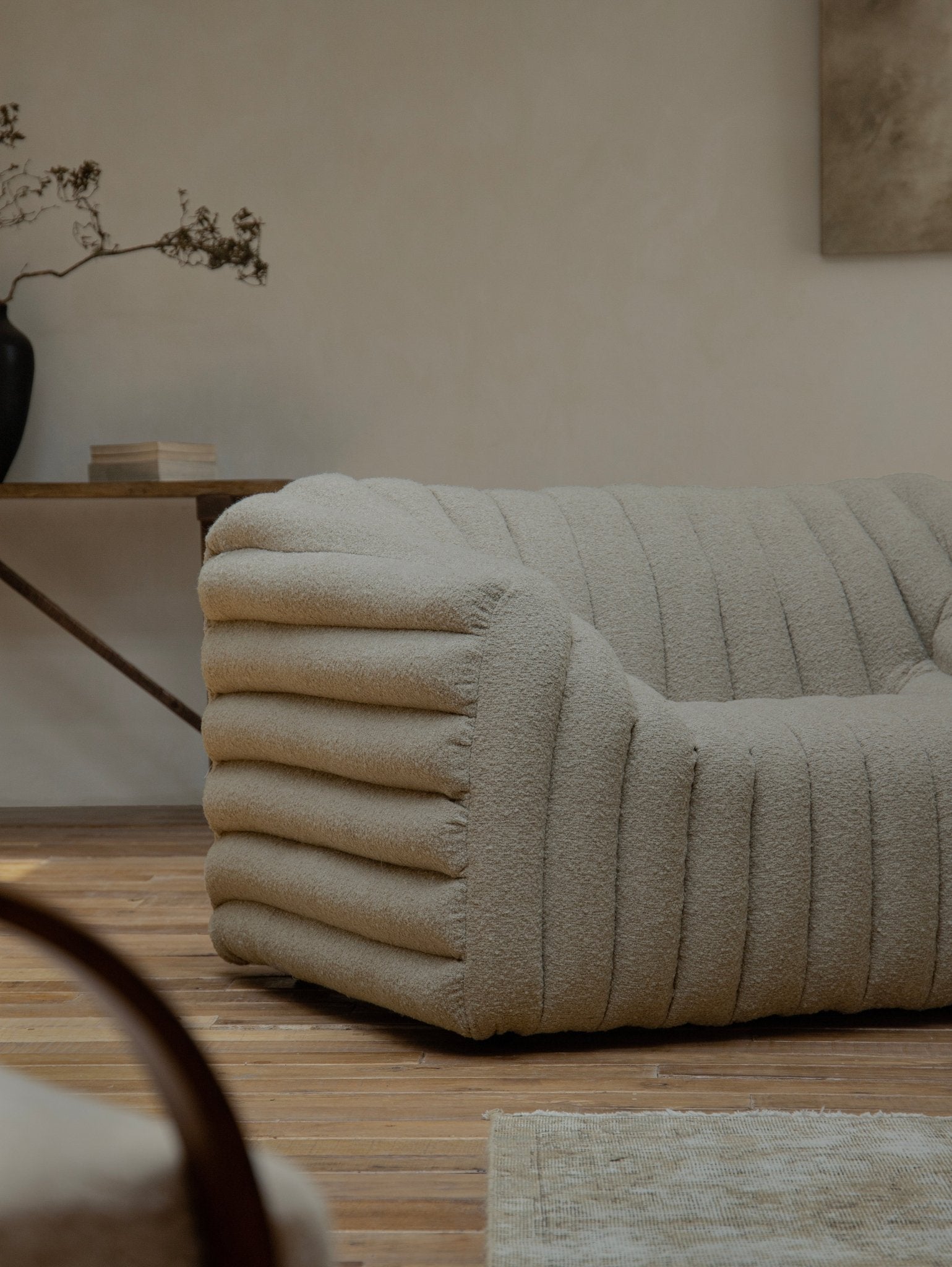 Miche Sofa in beige with vertical ribbed design, accentuating cozy living space with comfortable style