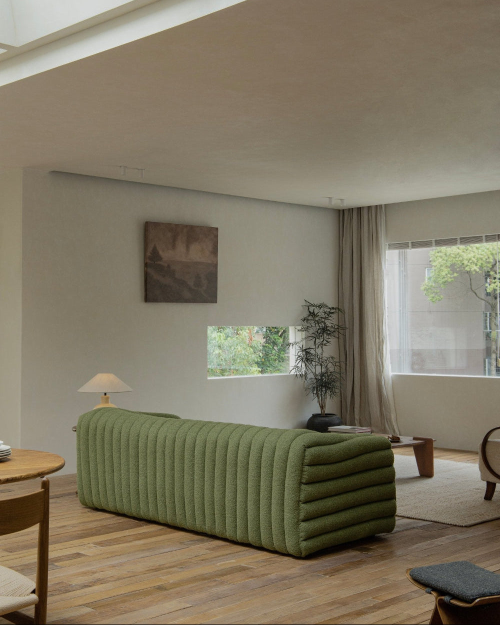 Miche Sofa in green with vertical ribbed design, accentuates cozy living space with comfortable style