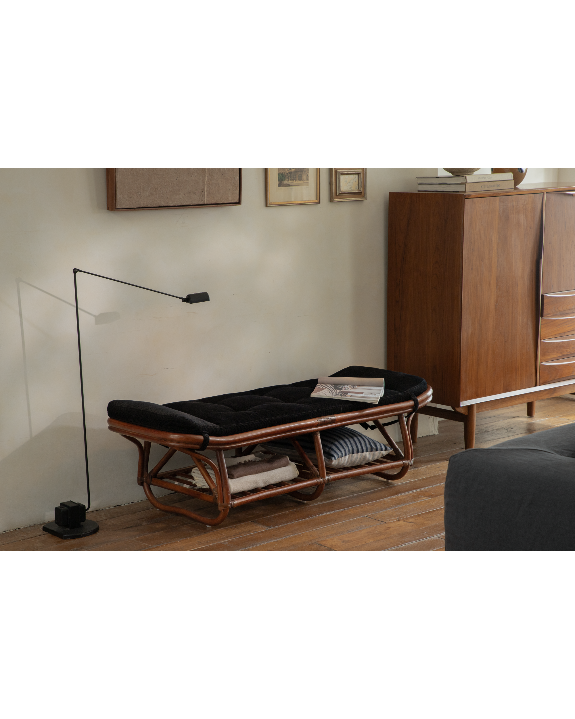 Twyla rattan storage bench with black corduroy cushion and lower storage shelf.