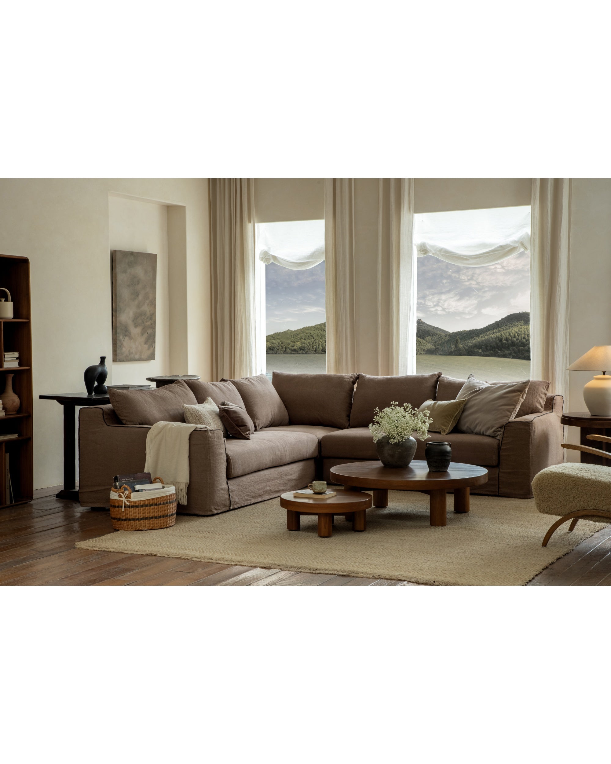 Modular Noa sectional sofa in taupe Belgian linen, showcasing plush comfort and versatile arrangement in a modern home.