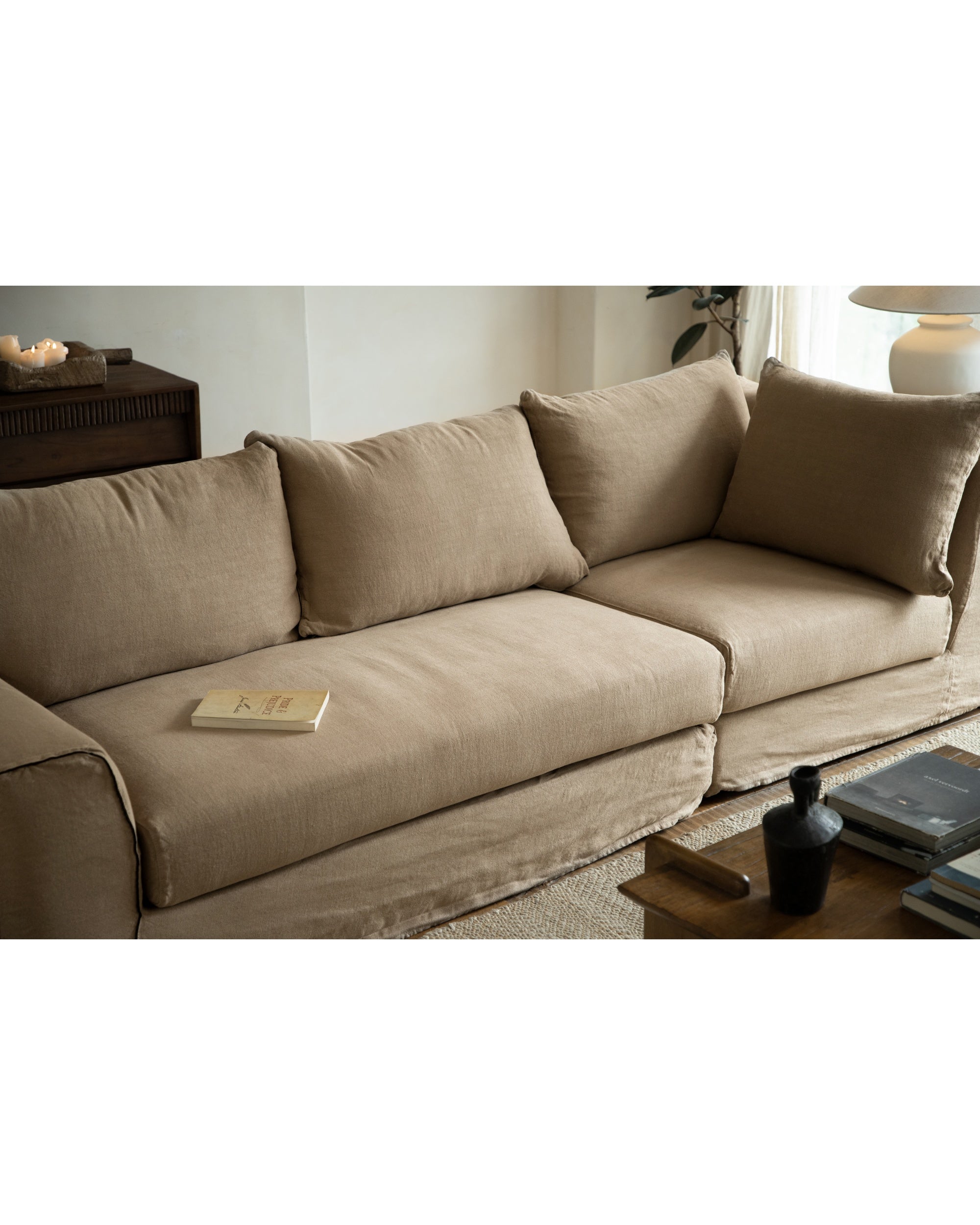 Noa Sectional Sofa in tan Belgian linen. Modular design, plush cushions, modern living room style.