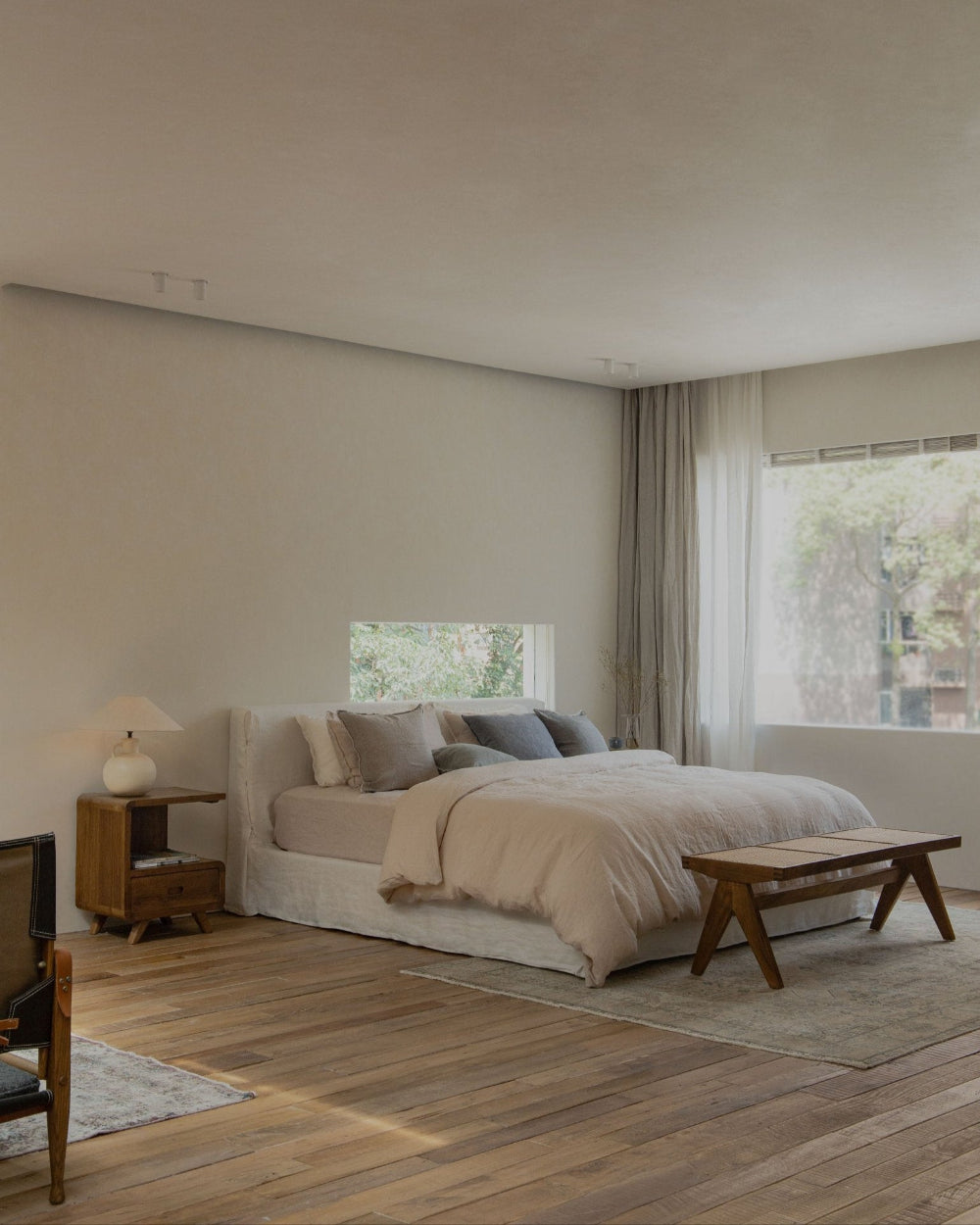 Freya Linen Bed in neutral bedroom, natural linen upholstery, wooden furniture, peaceful sleep