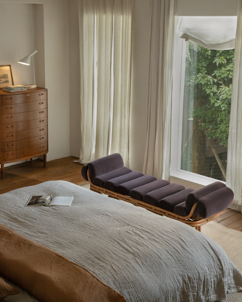 Bridget Bench: rattan frame, segmented plush velvet cushions, bedroom setting.