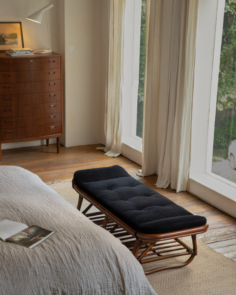 Twyla rattan storage bench with tufted dark corduroy cushion
