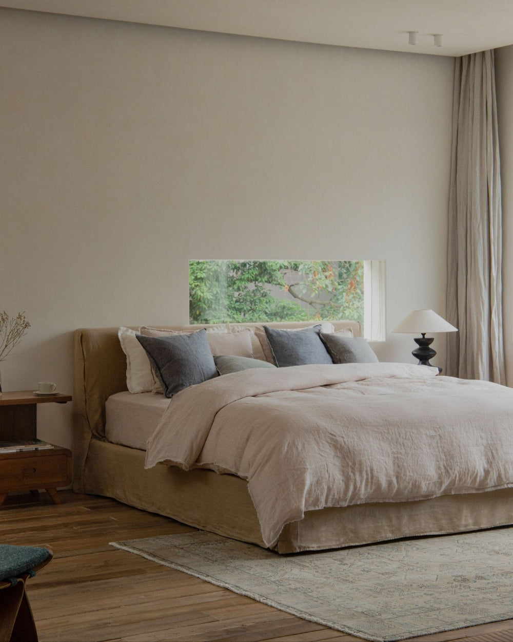 Freya Linen Bed in modern bedroom, natural linen upholstery, peaceful sleep, neutral tones, minimalist design