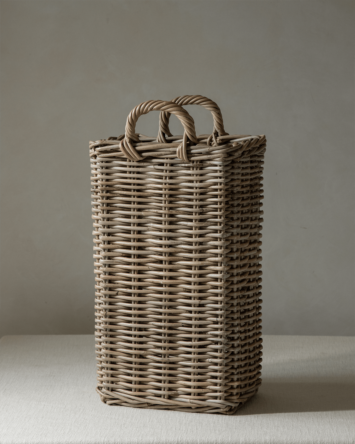 Oliver handwoven rattan basket with curved handles, natural material
