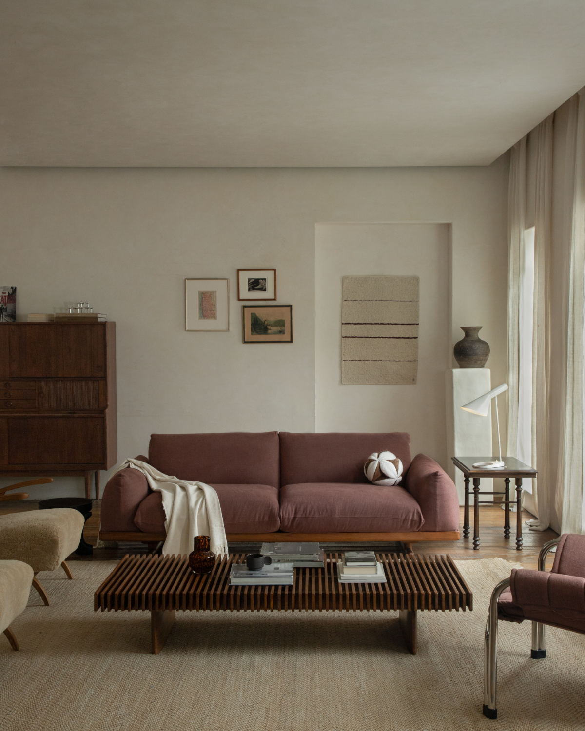 Adrian Sofa in rust linen with teak base in a modern living room
