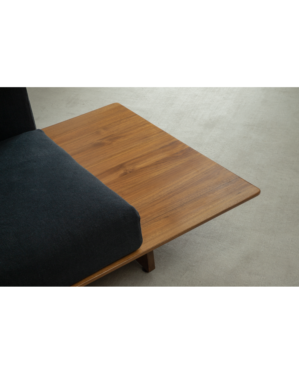 Tatami Linen Modular Sofa section with dark grey linen seat and teak wood side table.
