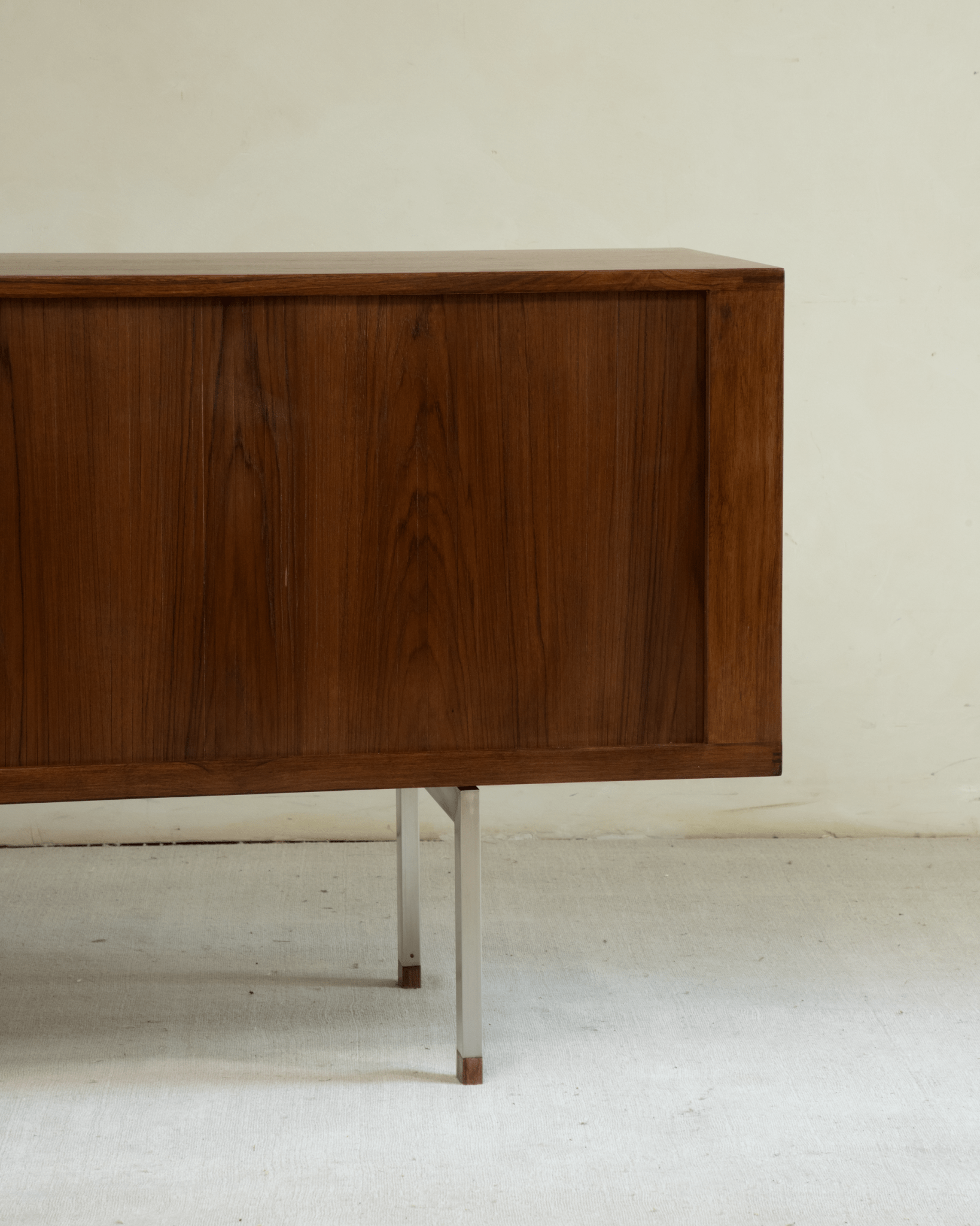 Martin Credenza: Solid teak wood grain, mid-century styling, elevated stainless steel legs.