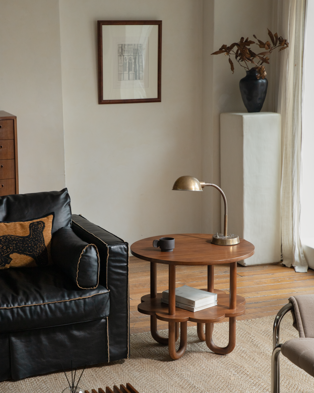 Solid teak wood Daisy Side Table with staggered tiers and curved U-shaped legs.
