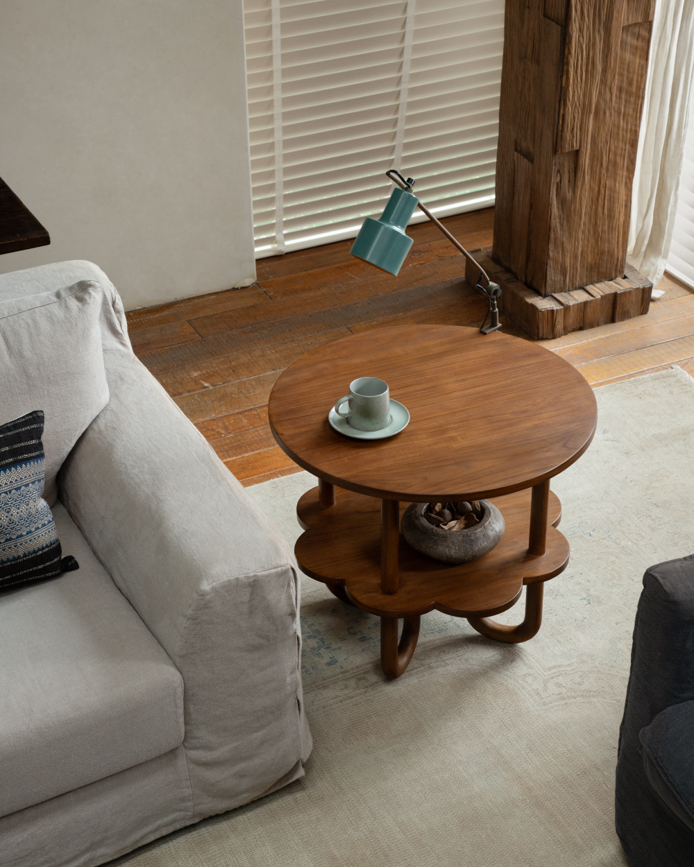 Daisy side table: Round teak wood accent with staggered tiers and curved legs.