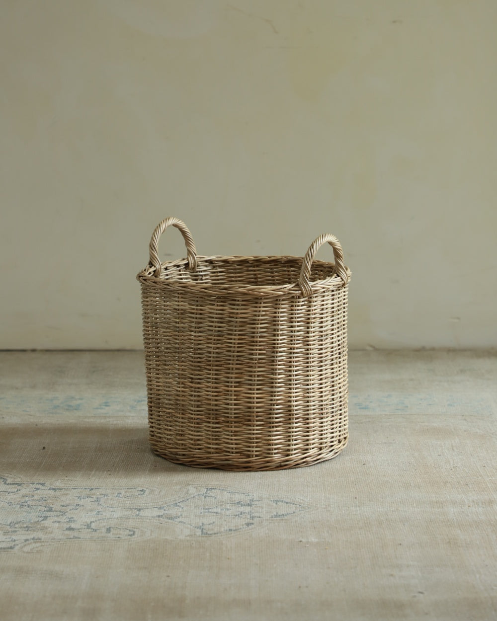 Aria round hand-woven rattan storage basket with handles