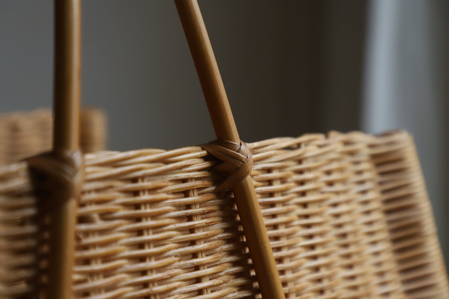 June Basket: Hand-woven natural rattan weave and handle detail.