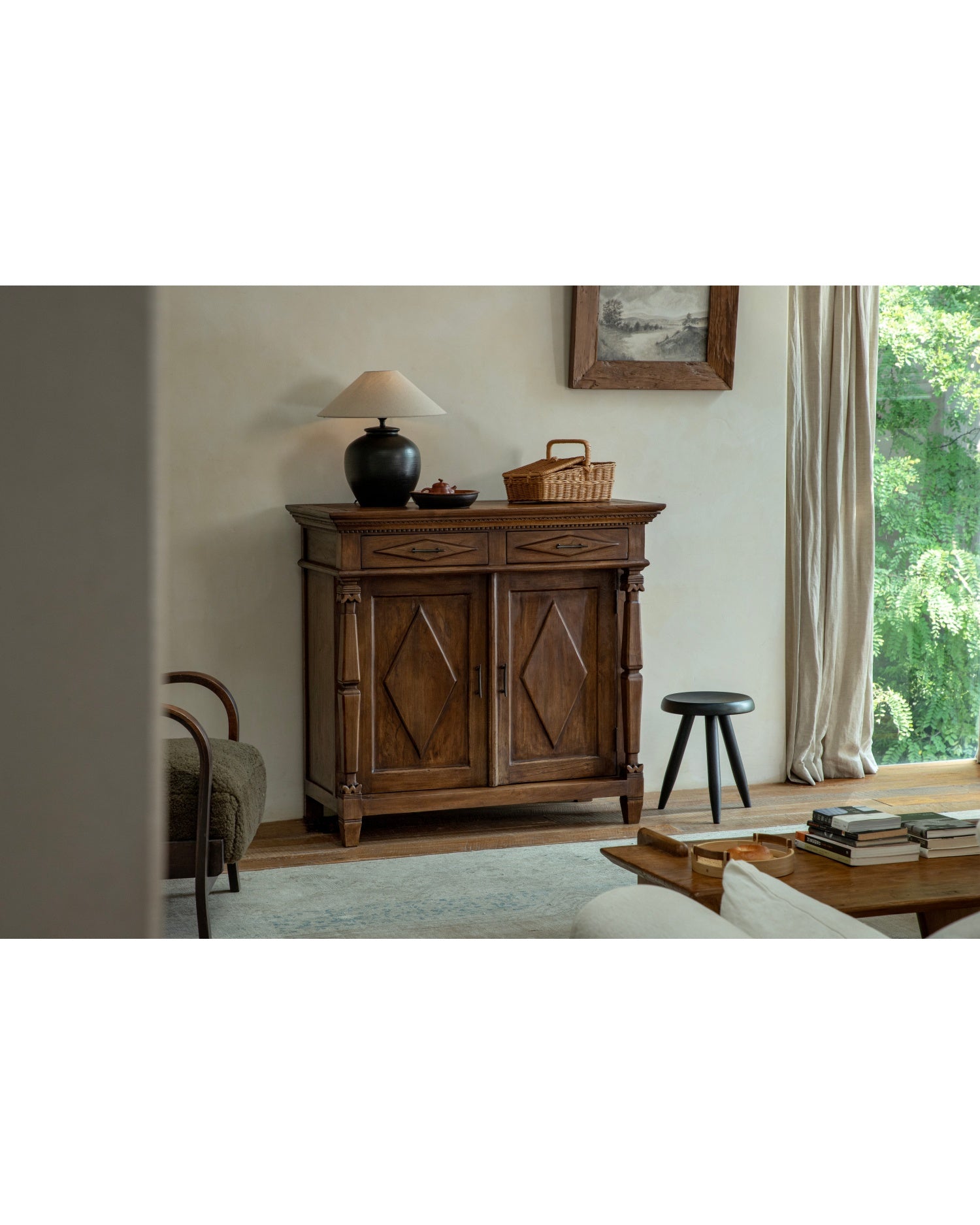 Victoria Teak Cabinet with antique finish, Roman columns, and carved doors.