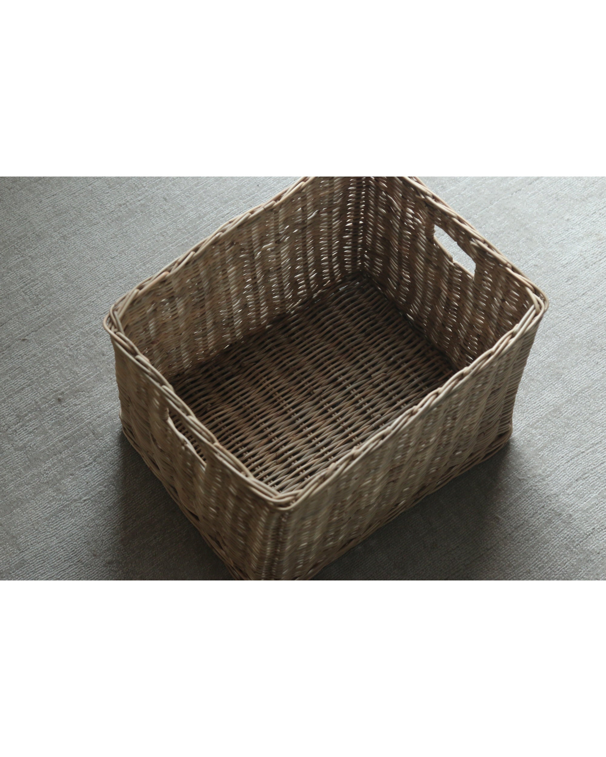 Rectangular natural woven storage basket with dense texture and open top