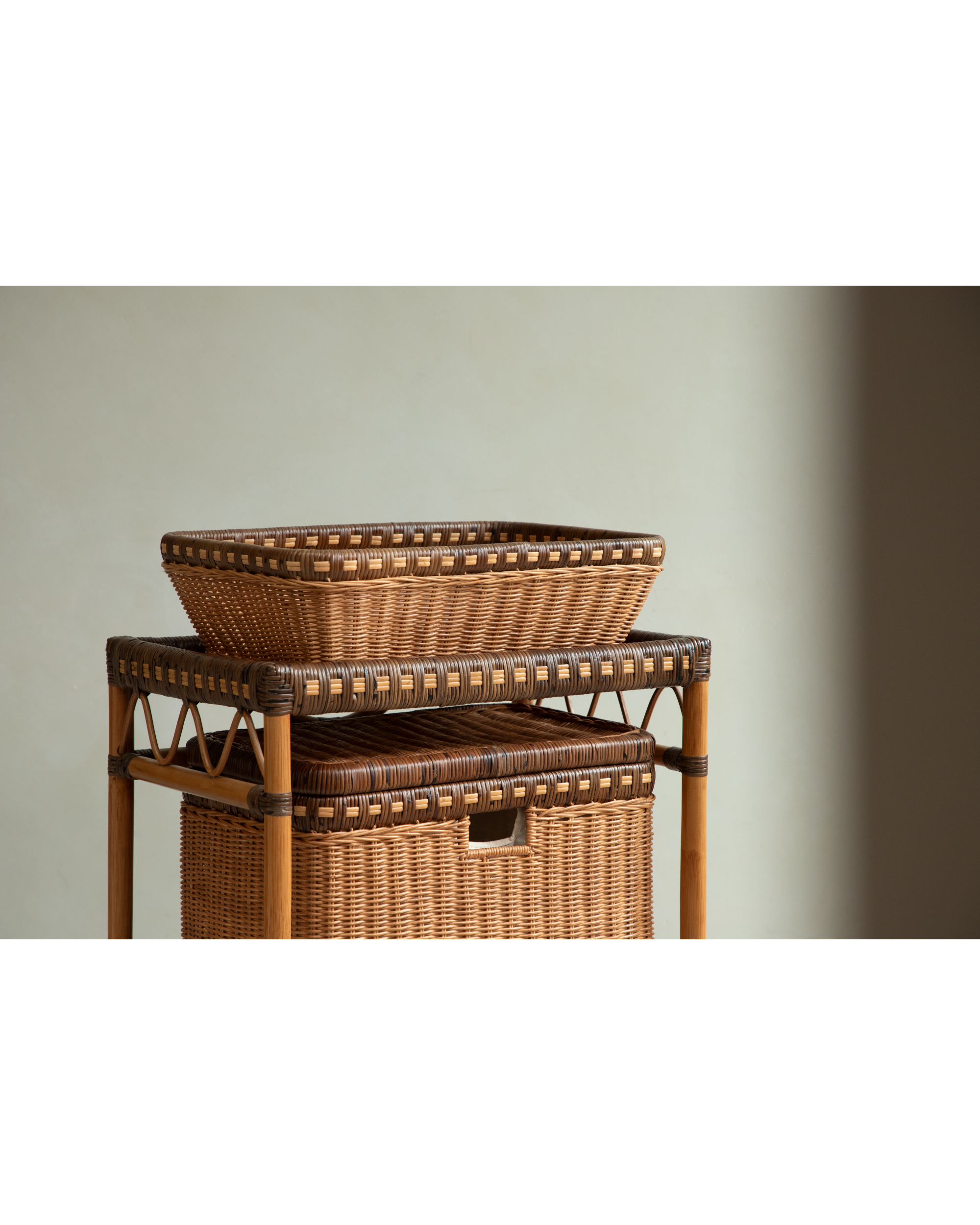 Milo Rattan Laundry Cart: stacked woven Indonesian rattan baskets & frame.