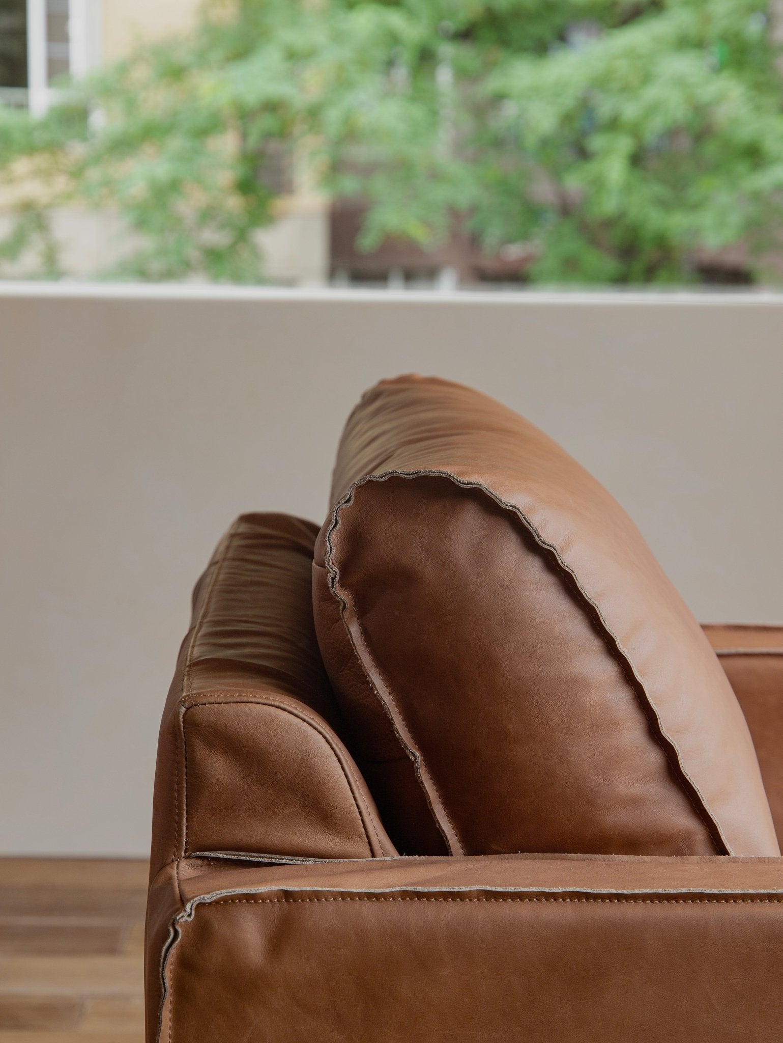Brown top-grain leather skirt sofa detail, highlighting the quality and design